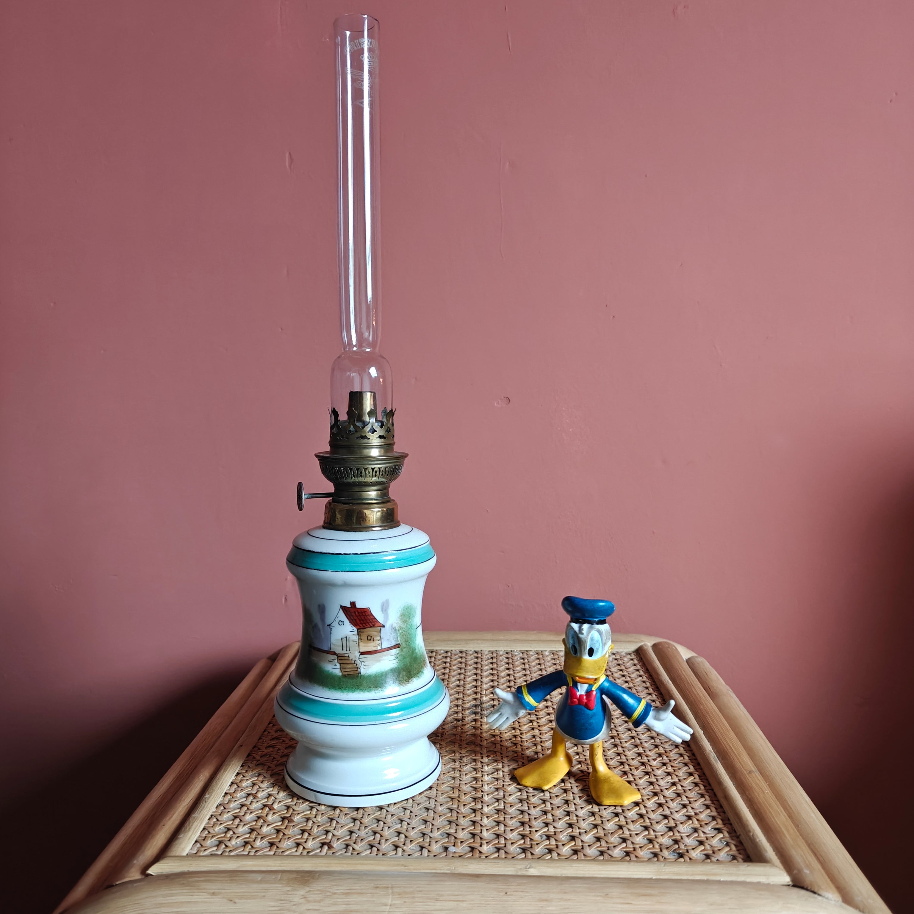 Beautiful Vintage Porcelain Oil Lamp – Hand-Painted with SIAE Burner (1950s) on wooden table with plain background