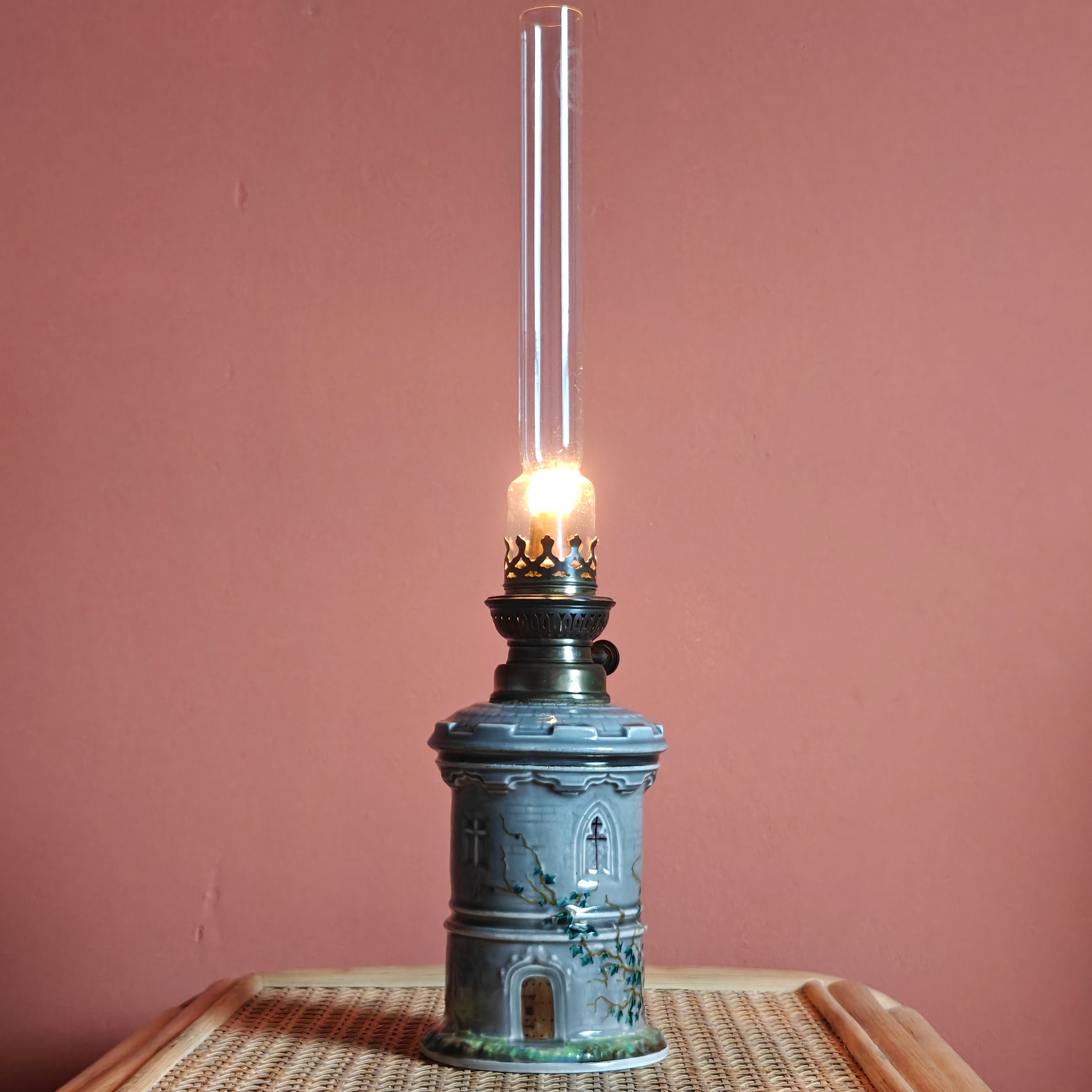 Rare Vintage Ceramic Oil Lamp – Tower Design with SIAE Burner (1930s) lit, detailed hand-painted ceramic tower shape.