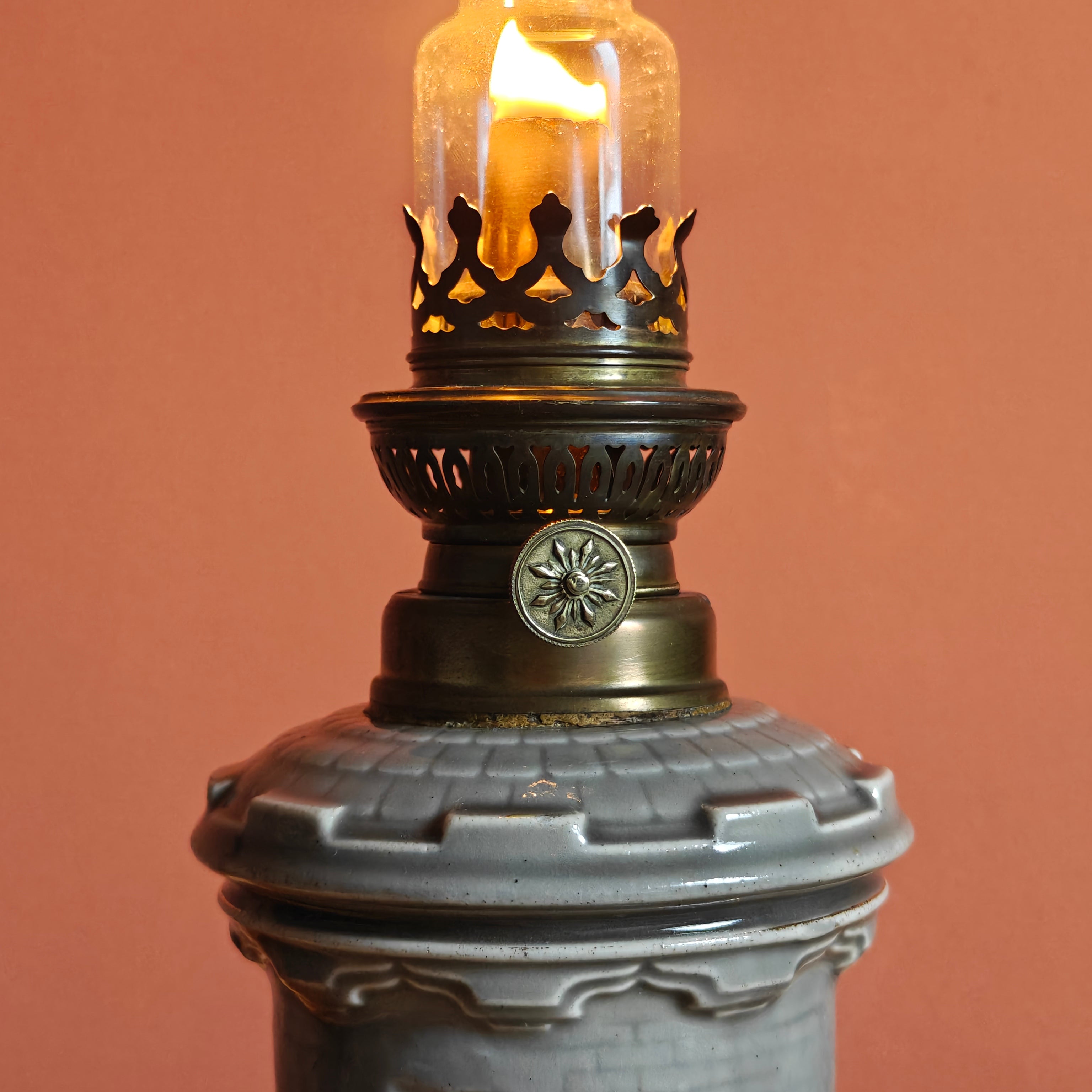 Rare Vintage Ceramic Oil Lamp – Tower Design with SIAE Burner (1930s) lit showing metal burner detail and ceramic base.
