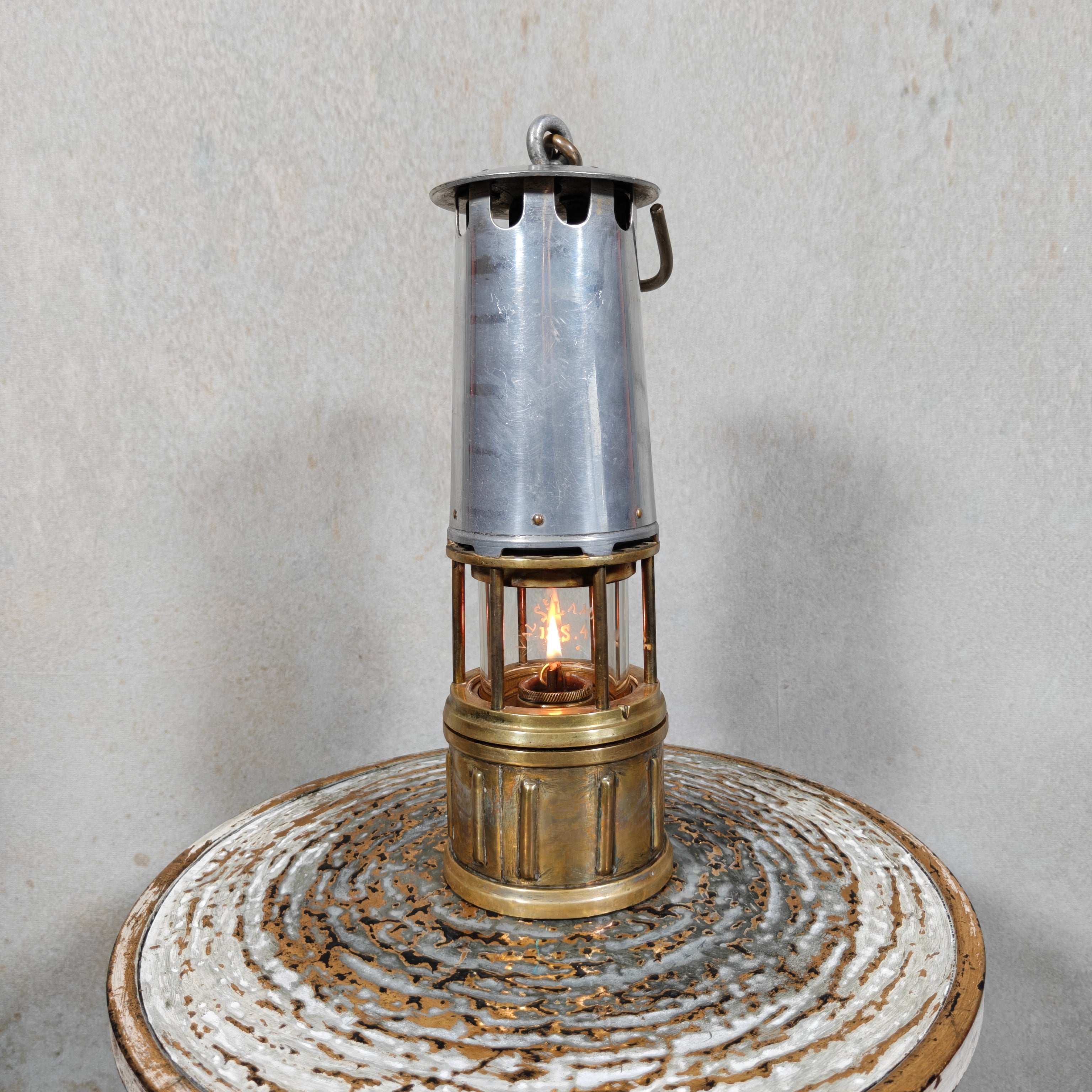 Beautiful, Miner’s Lamp – ca. 1900 – With Val St. Lambert D.S.4 Glass vintage oil lamp with metal casing and lit flame