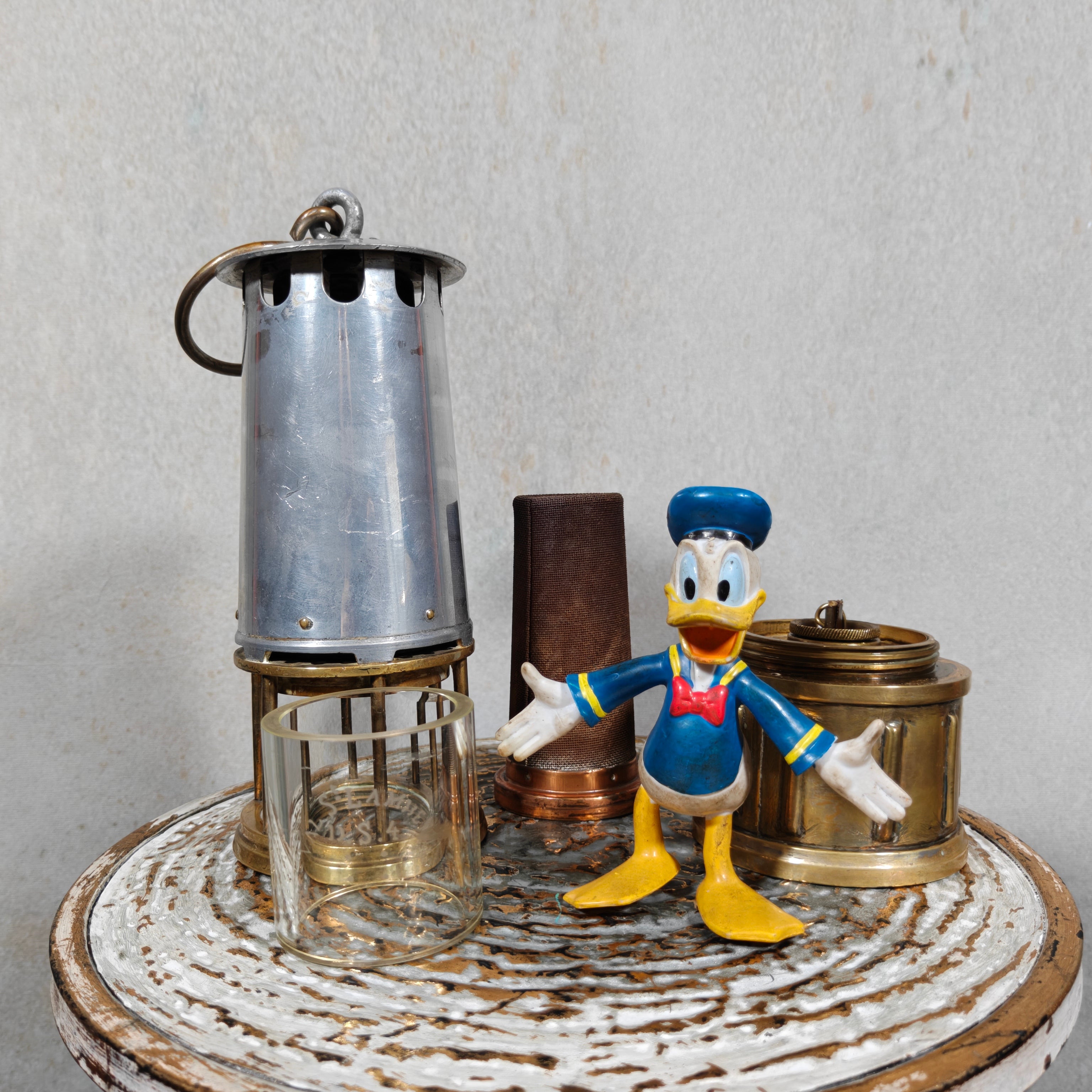Beautiful, Miner’s Lamp – ca. 1900 – With Val St. Lambert D.S.4 Glass oil lamp components displayed on a rustic surface.