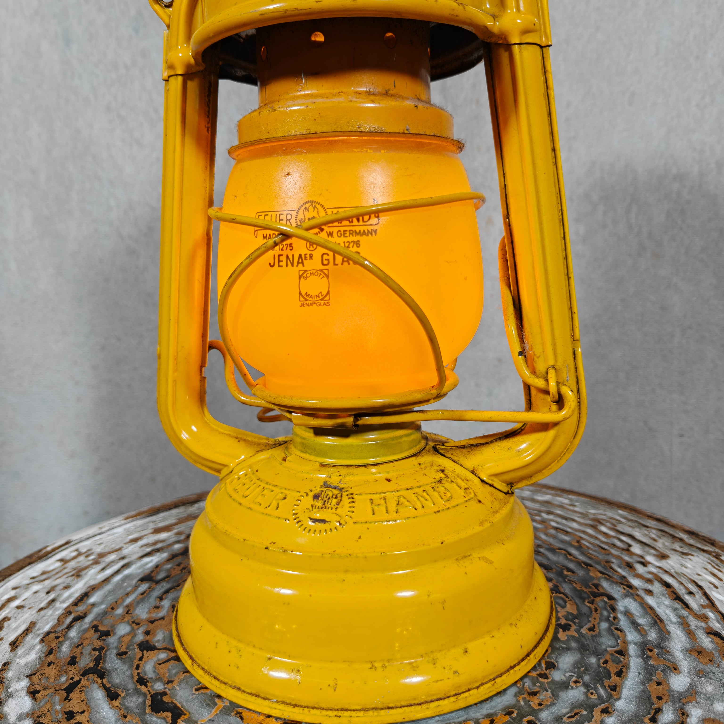 Beautiful Yellow Feuerhand Hurricane Lantern – Baby 276 STK/120 – Vintage Safety Lantern – Germany showing detailed close-up of oil lamp body.