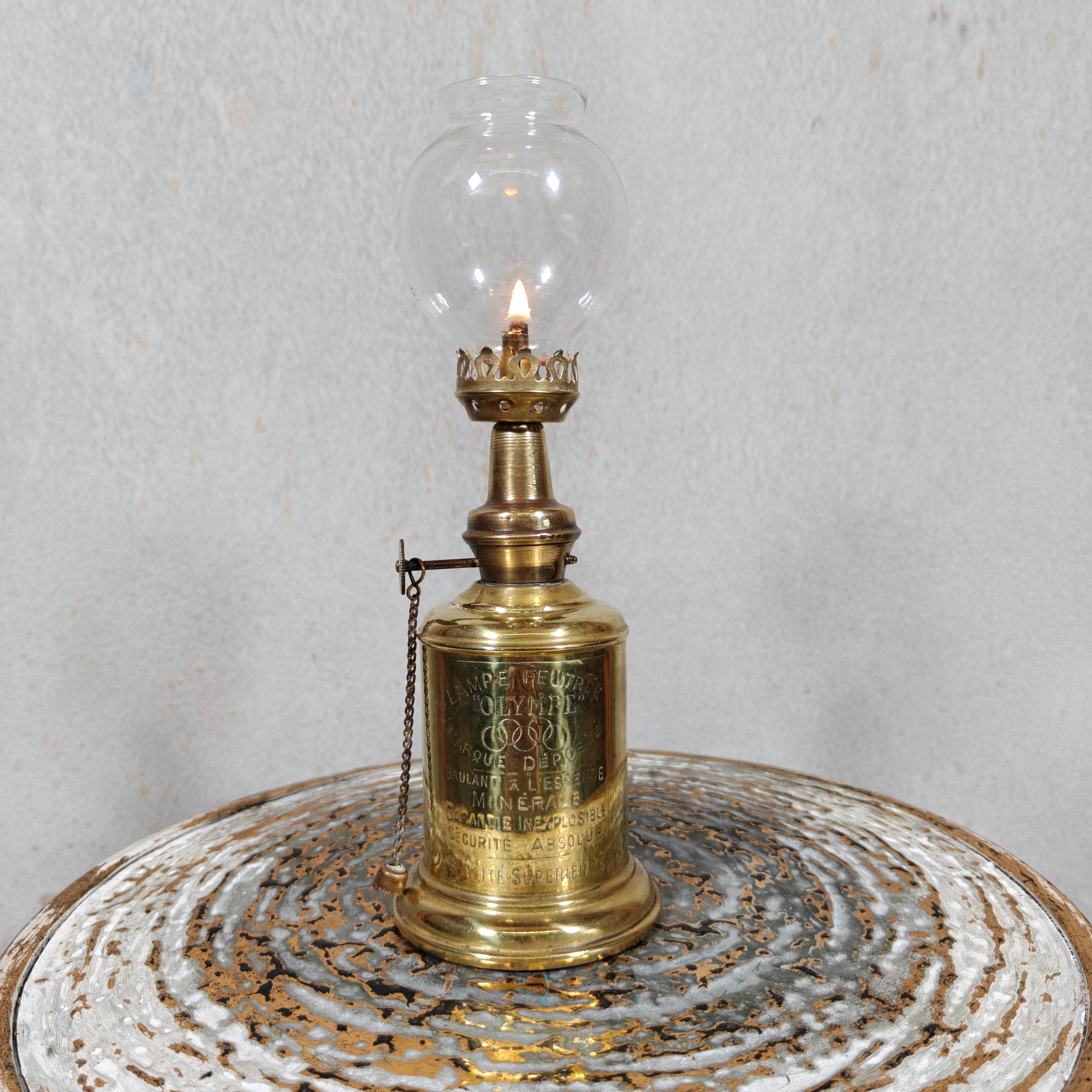 Vintage Oil Lamp – “Lampe Olympe” – Pigeon‑Style Lamp with Gaudard Wick Holder showcasing classic brass design and lit flame ambiance