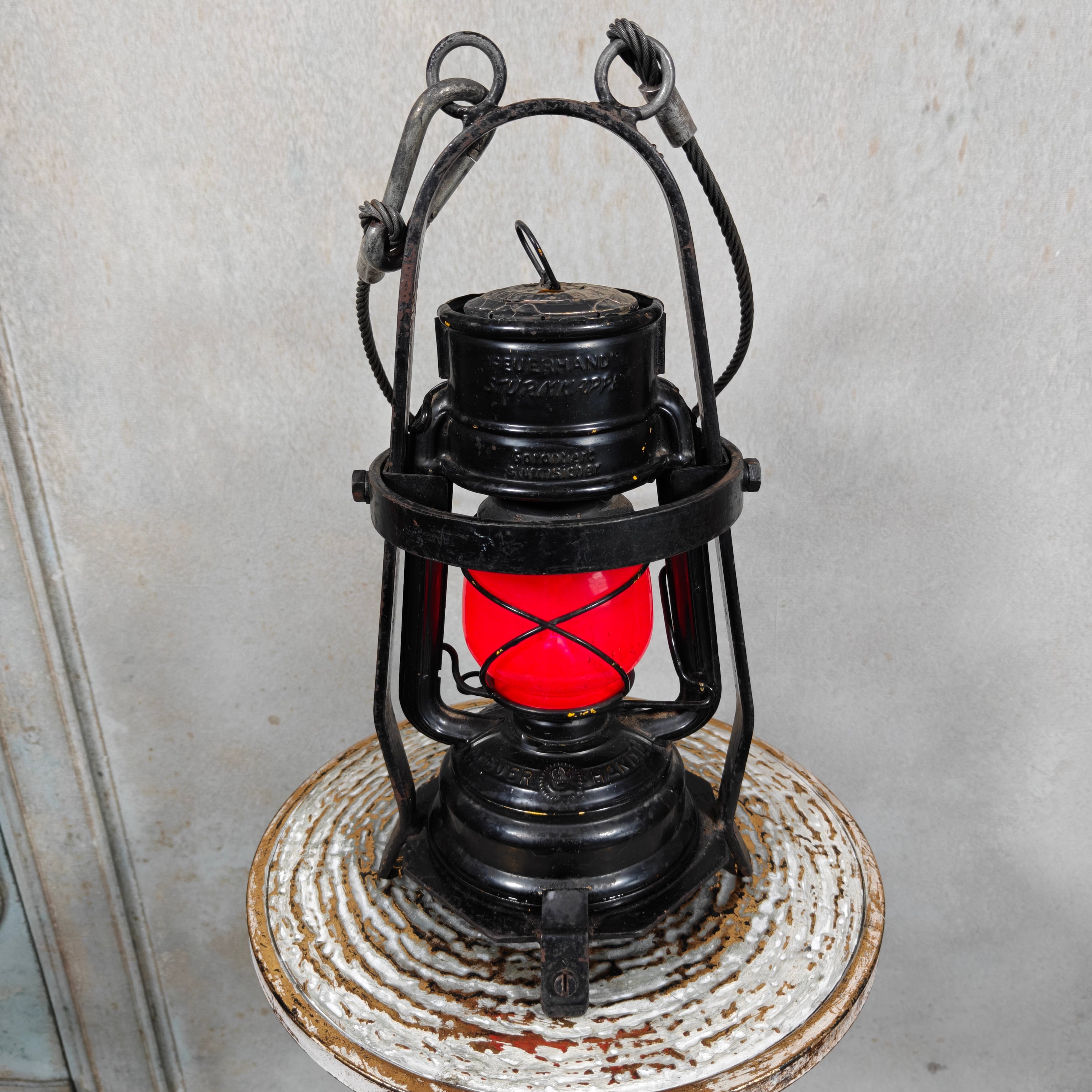 Rare Feuerhand 276 Work Lantern – Heavy-Duty Cage Frame – Vintage & Functional oil lamp with protective steel cage and red glass globe.