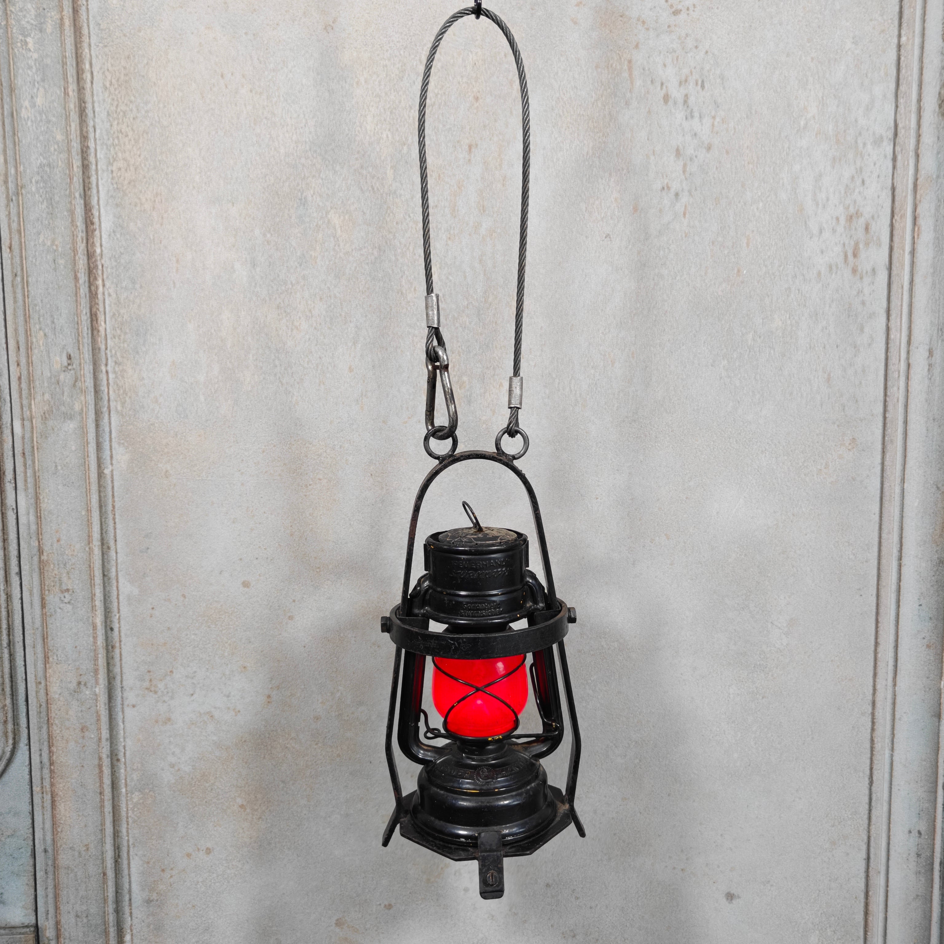 Rare Feuerhand 276 Work Lantern – Heavy-Duty Cage Frame – Vintage & Functional oil lamp with protective steel cage hanging against wall