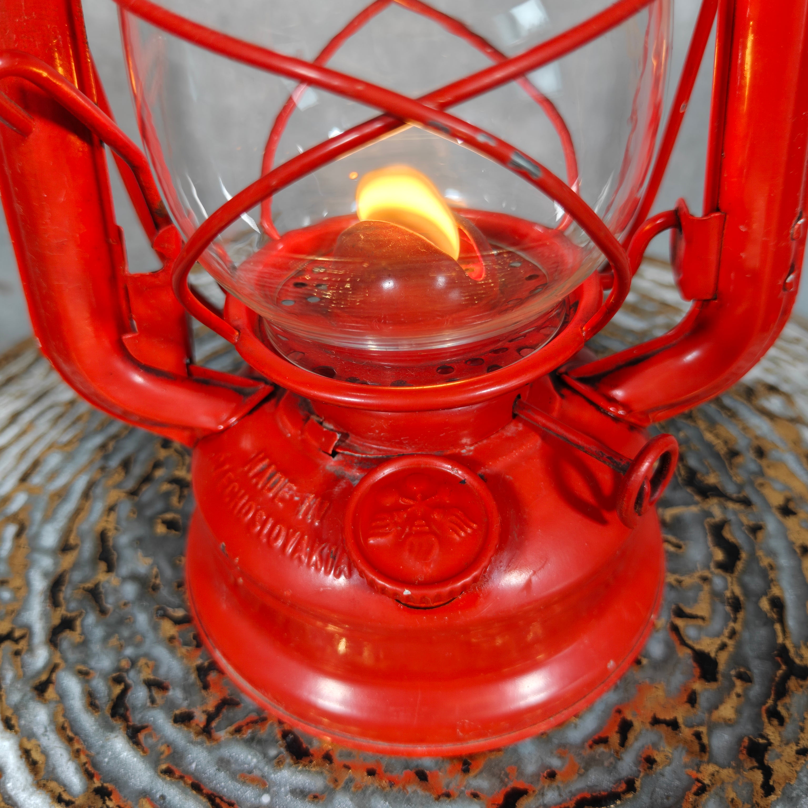 Beautiful and Functional Czech Storm Lantern – Meva 863 (1980) red oil lamp with lit flame and protective glass casing