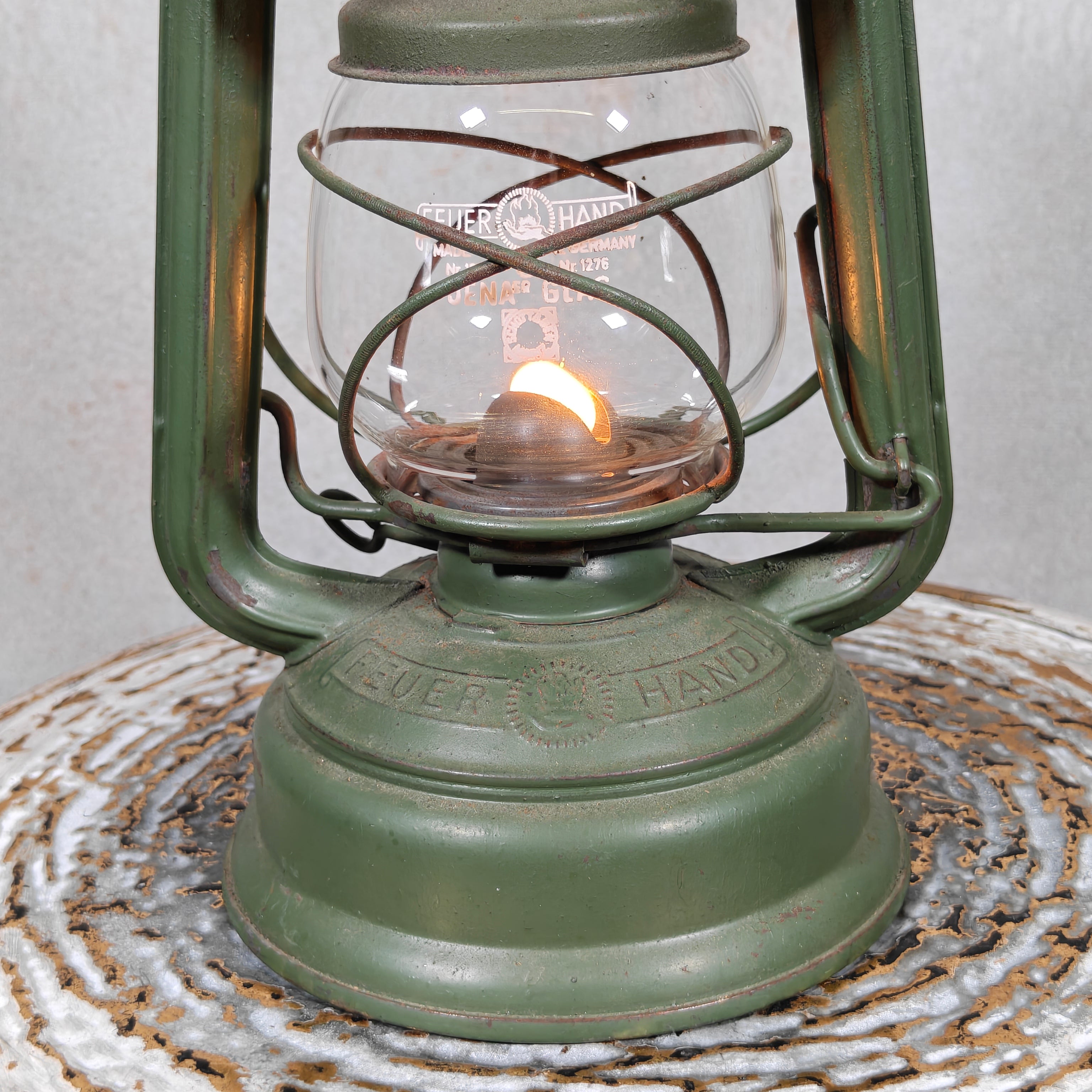 Hurricane lantern – Feuerhand 276 STK Sturmkappe – in good usable condition, with original glass and green painted finish.