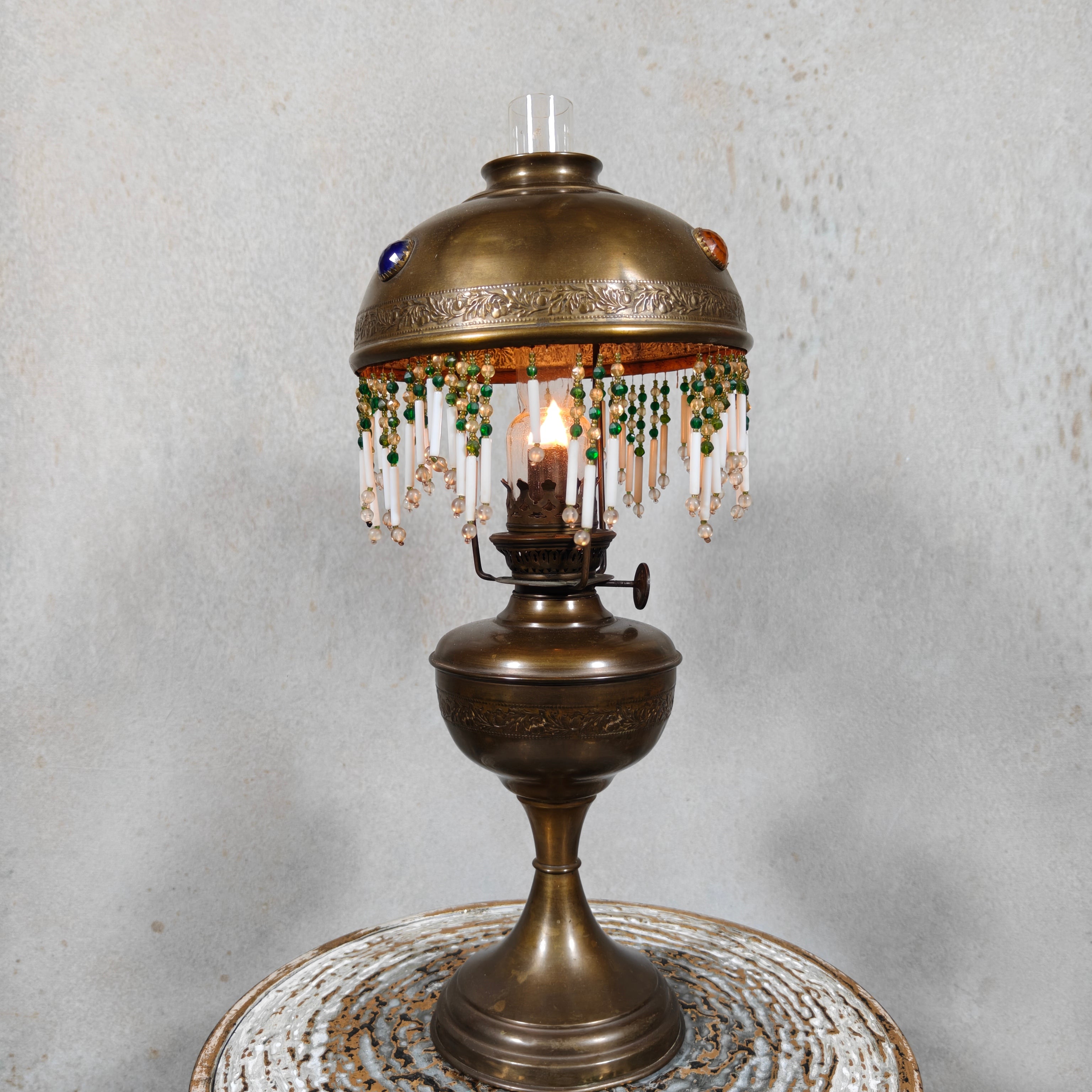 Ornate Brass Oil Lamp with Colored Glass Inserts and Beaded Details