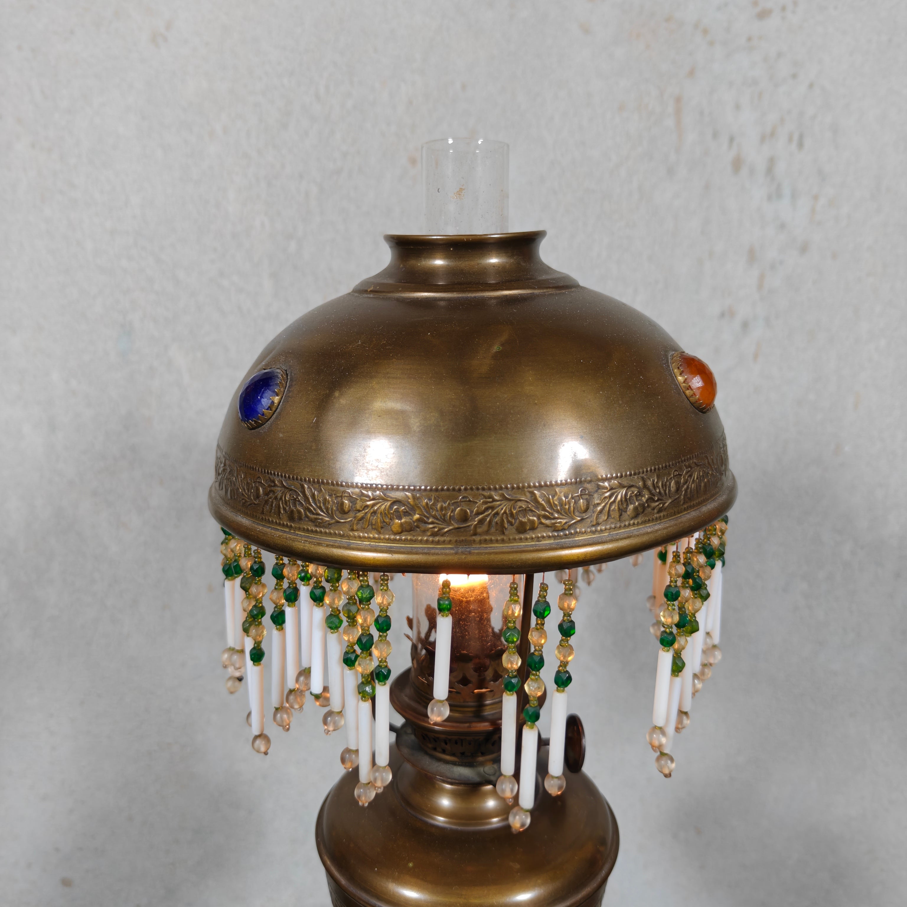 Ornate Brass Oil Lamp with Colored Glass Inserts and Beaded Details