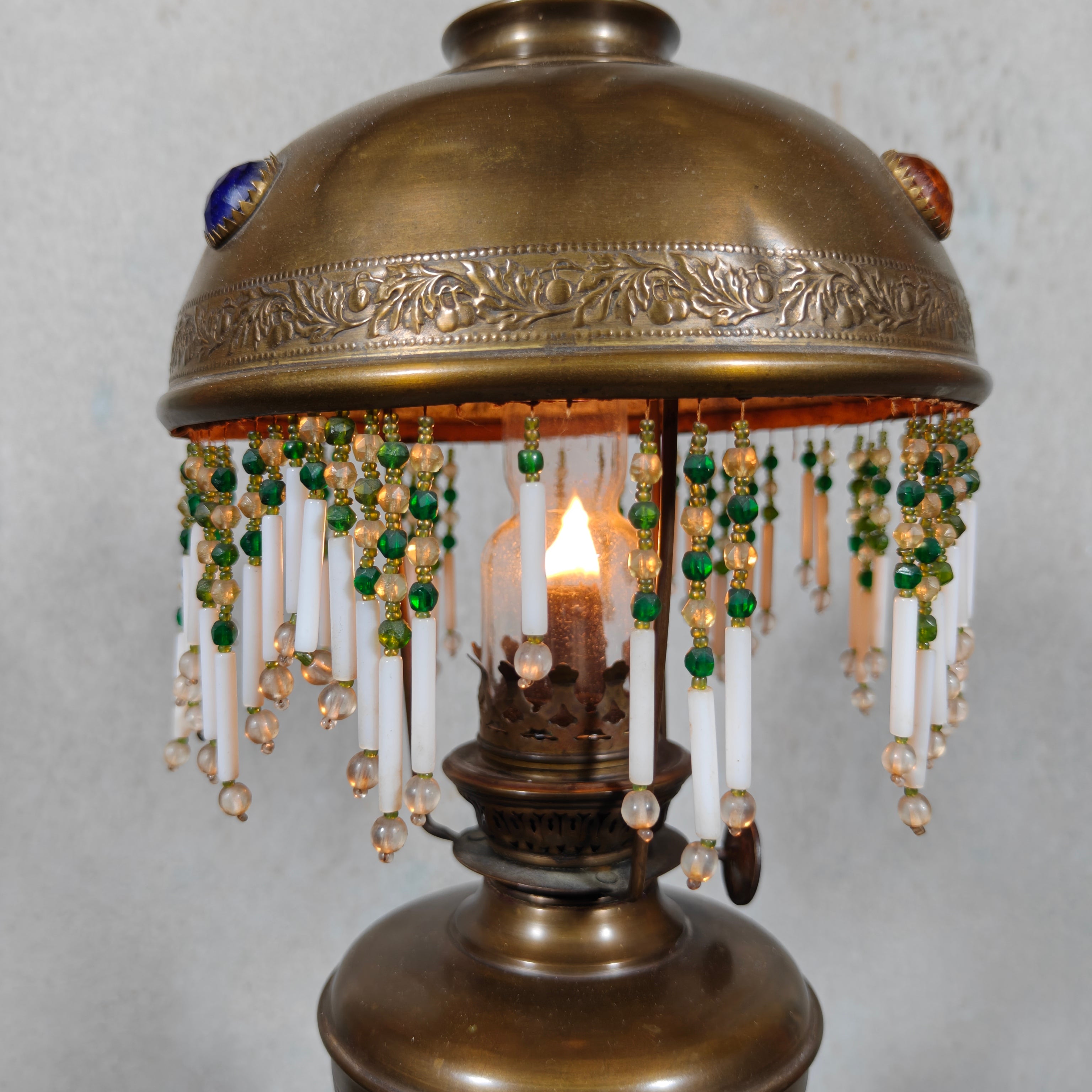 Ornate Brass Oil Lamp with Colored Glass Inserts and Beaded Details
