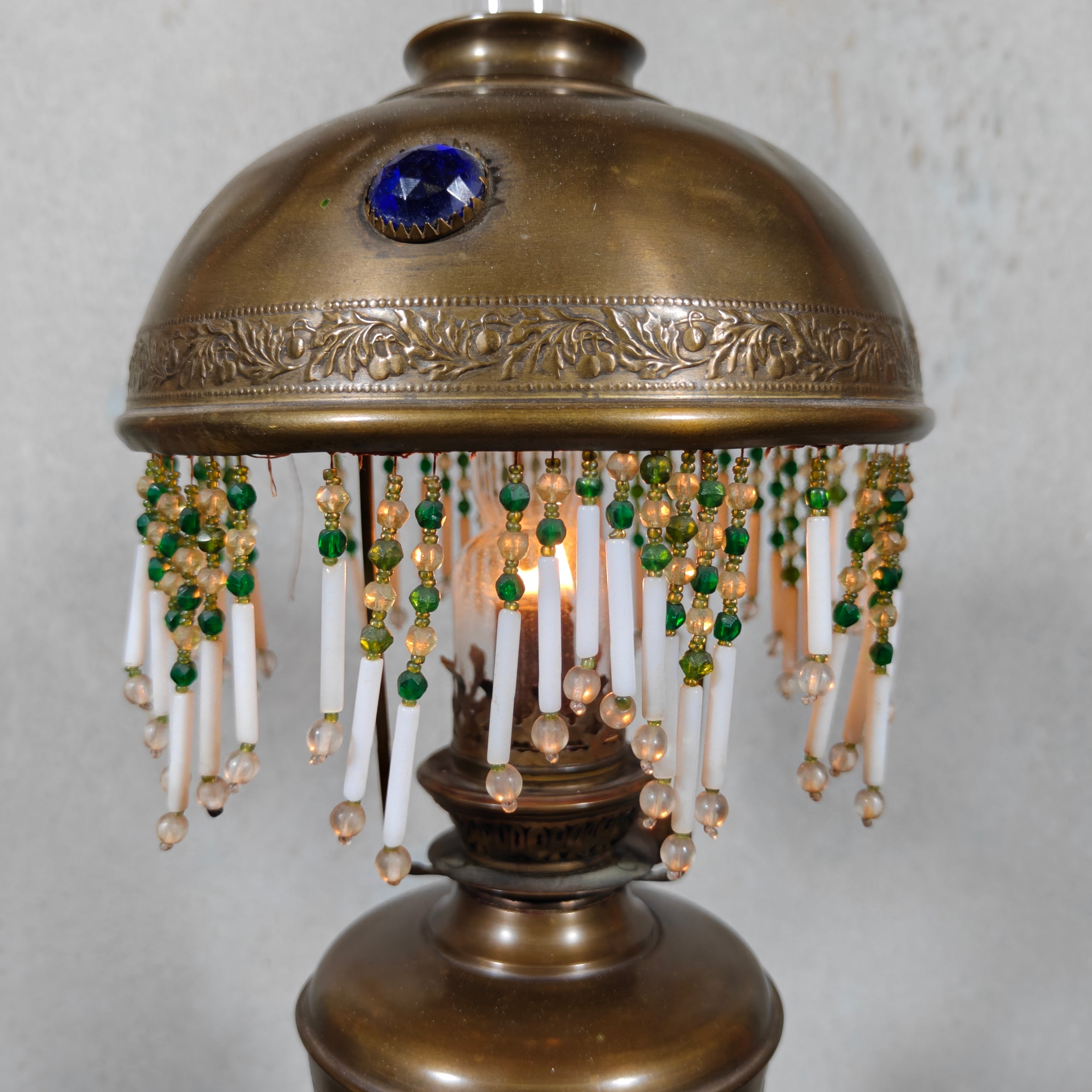 Ornate Brass Oil Lamp with Colored Glass Inserts and Beaded Details
