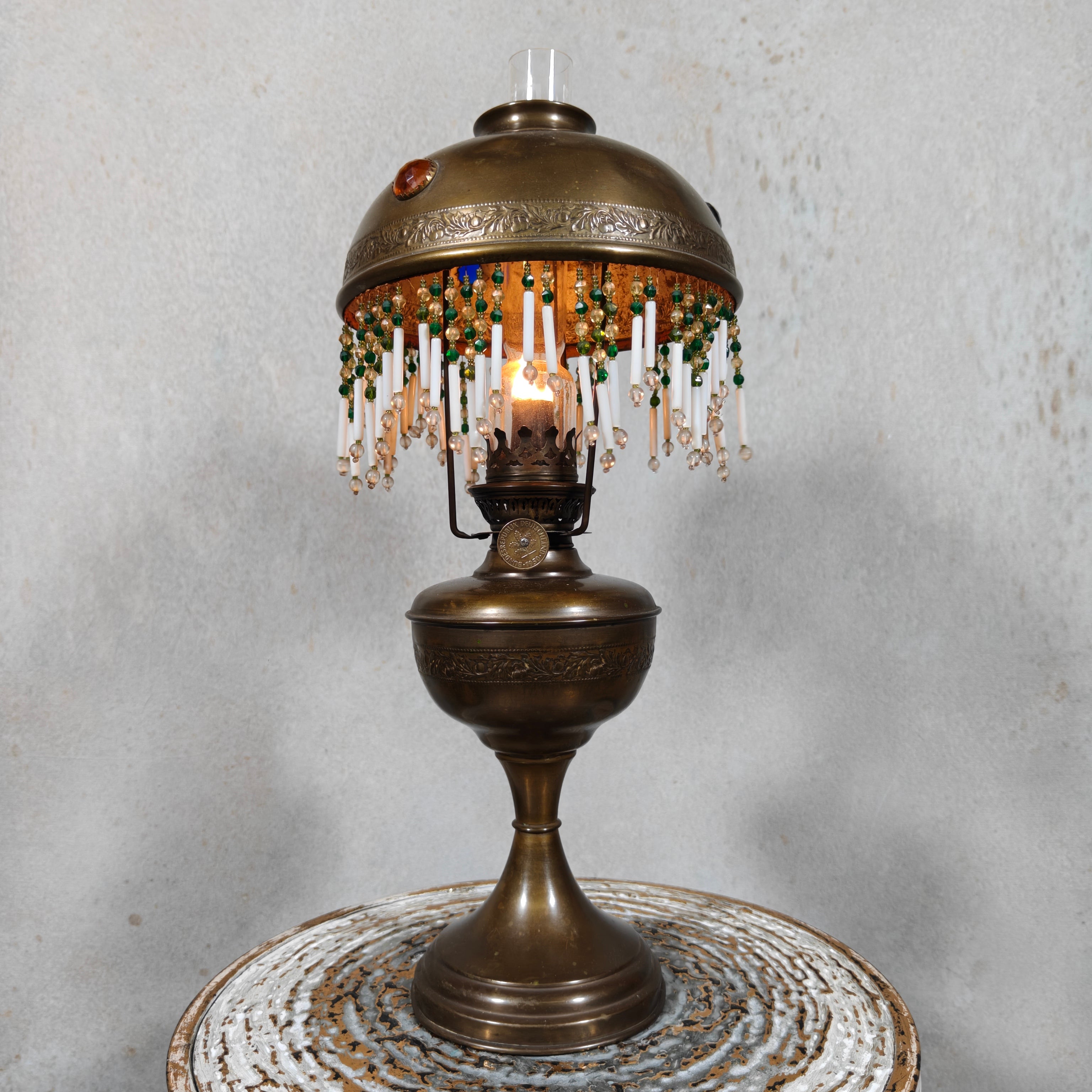 Ornate Brass Oil Lamp with Colored Glass Inserts and Beaded Details