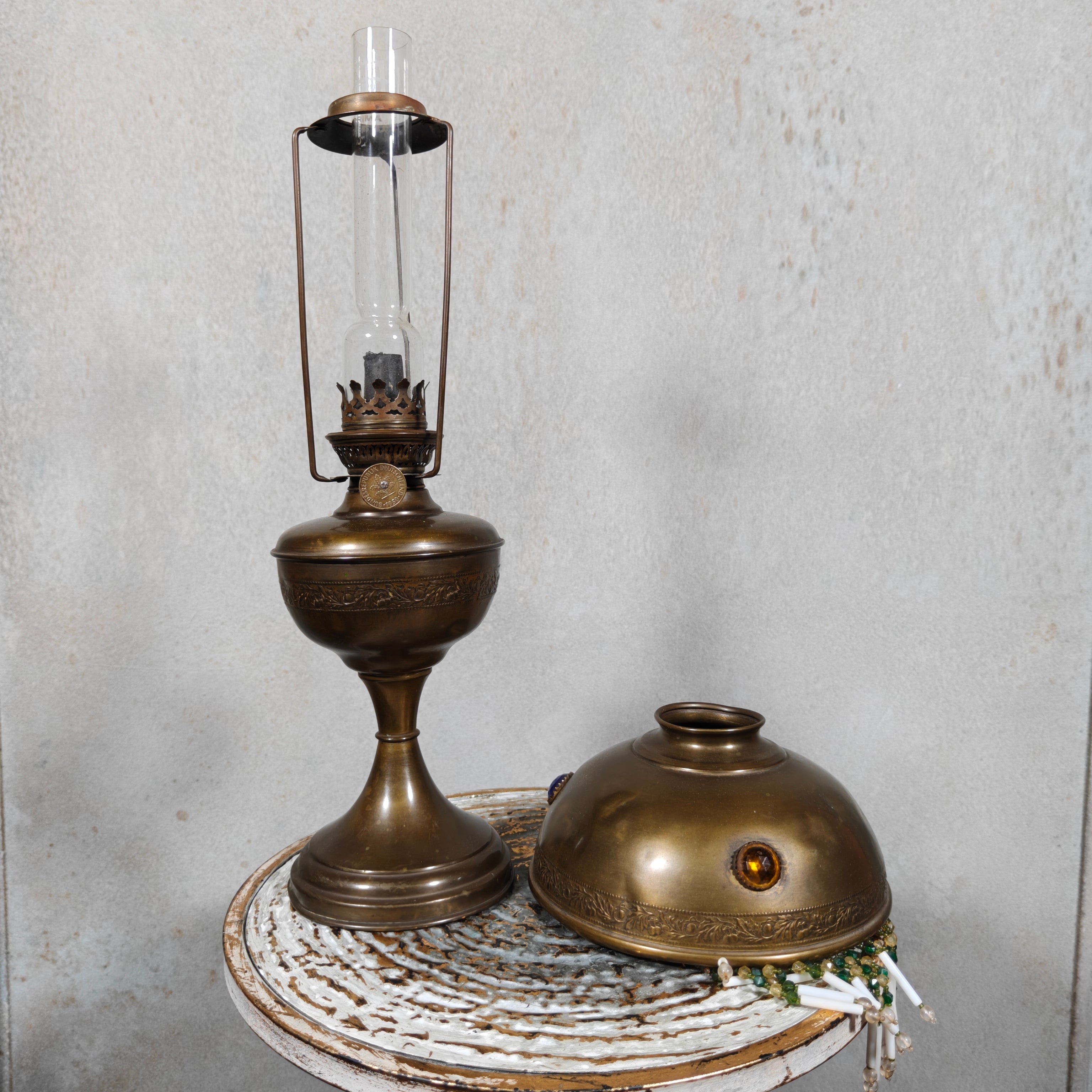 Ornate Brass Oil Lamp with Colored Glass Inserts and Beaded Details