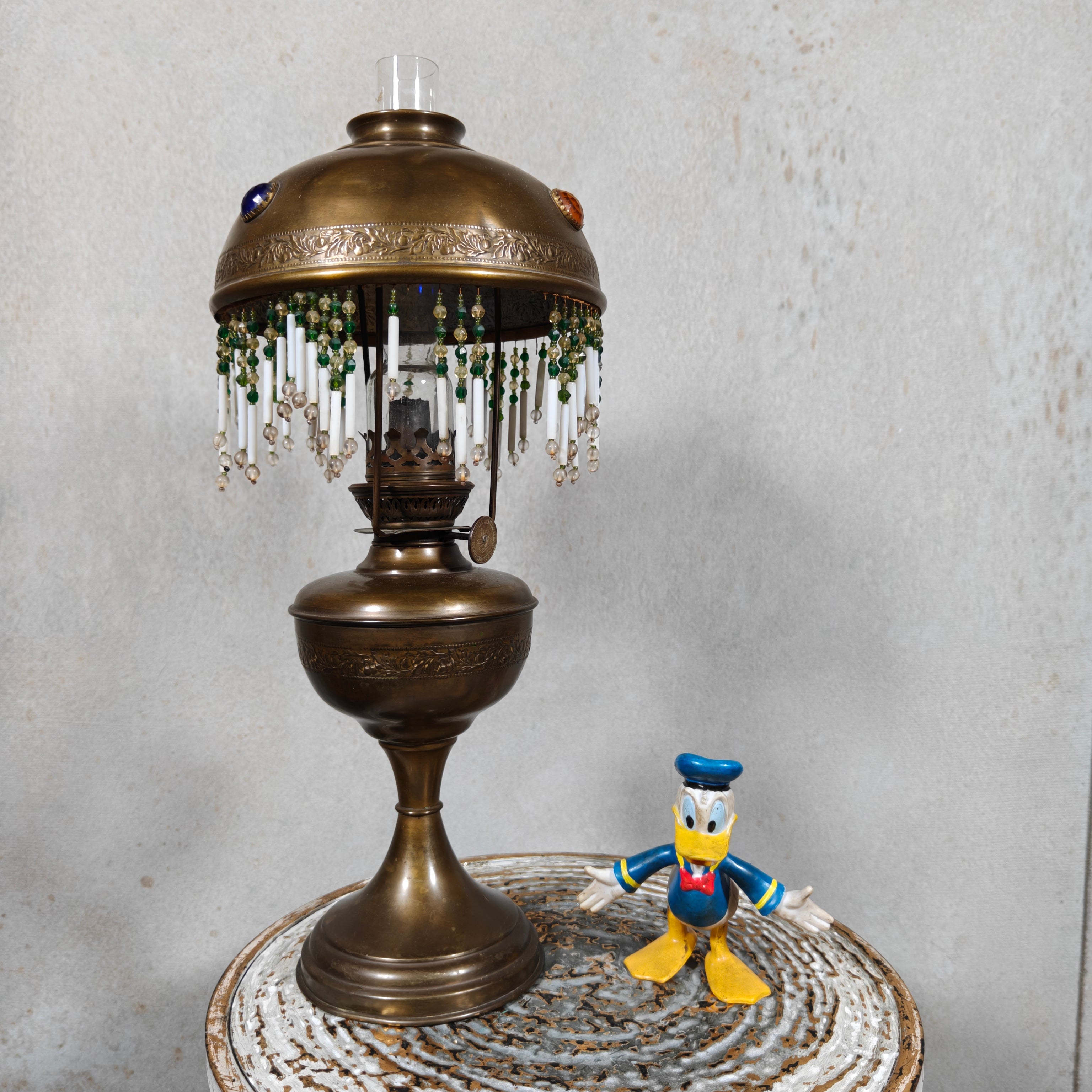 Ornate Brass Oil Lamp with Colored Glass Inserts and Beaded Details
