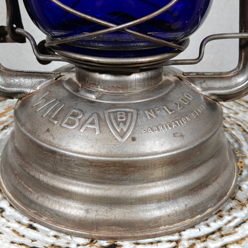 Close-up of the Wilba L200 fuel tank with embossed text: WILBA No. L200 – Fabrication Belge