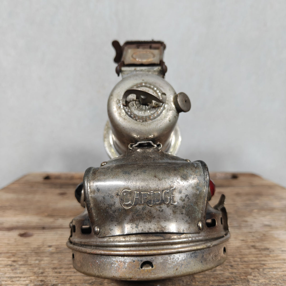 Antique Claridge Carbide Bicycle Lamp – Nickel, Red & Green Side Prisms, on Custom Stand