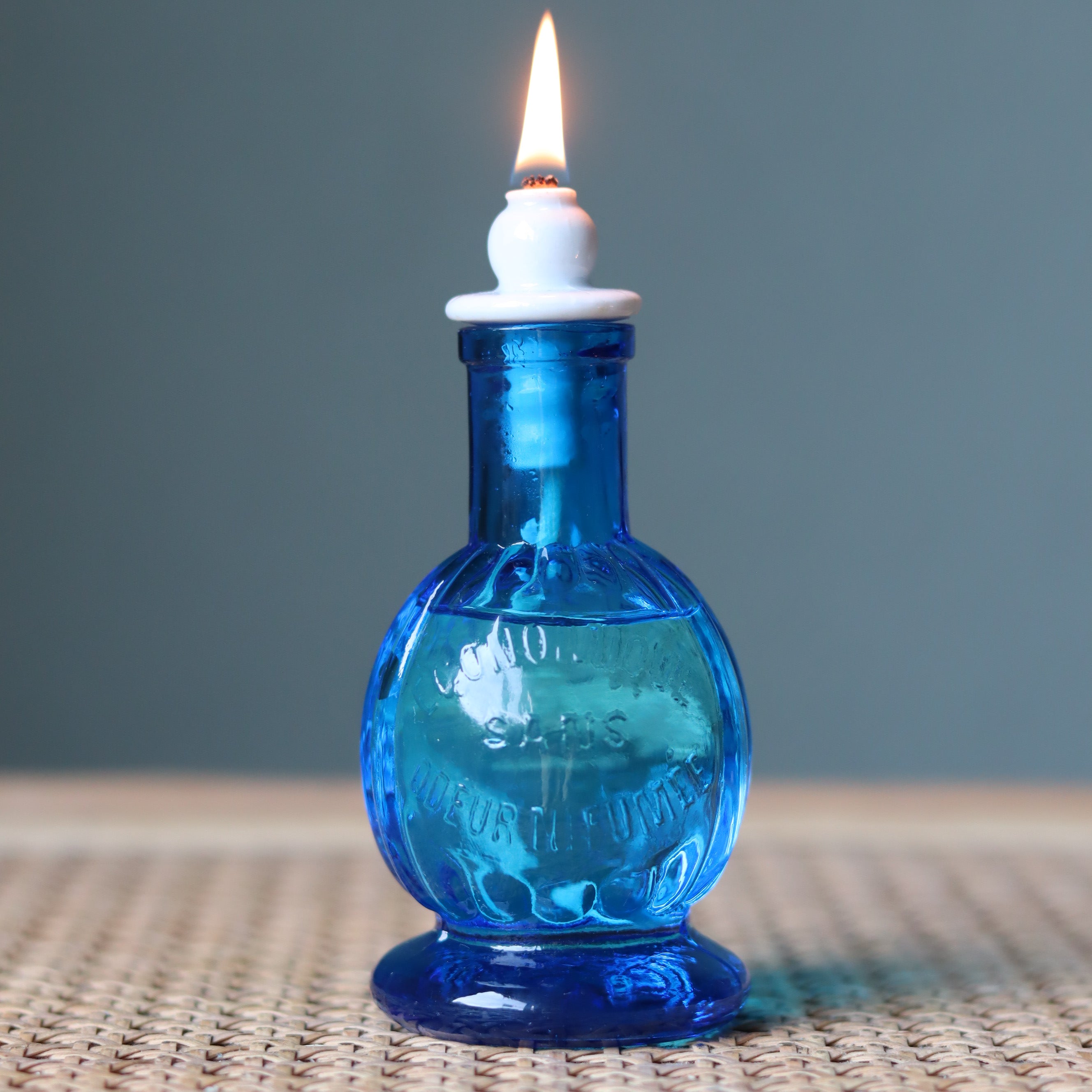 Rare Vintage French Oil Lamp – Blue Glass Bedside Nightlight (1930s–1950s) with lit wick on blue glass reservoir