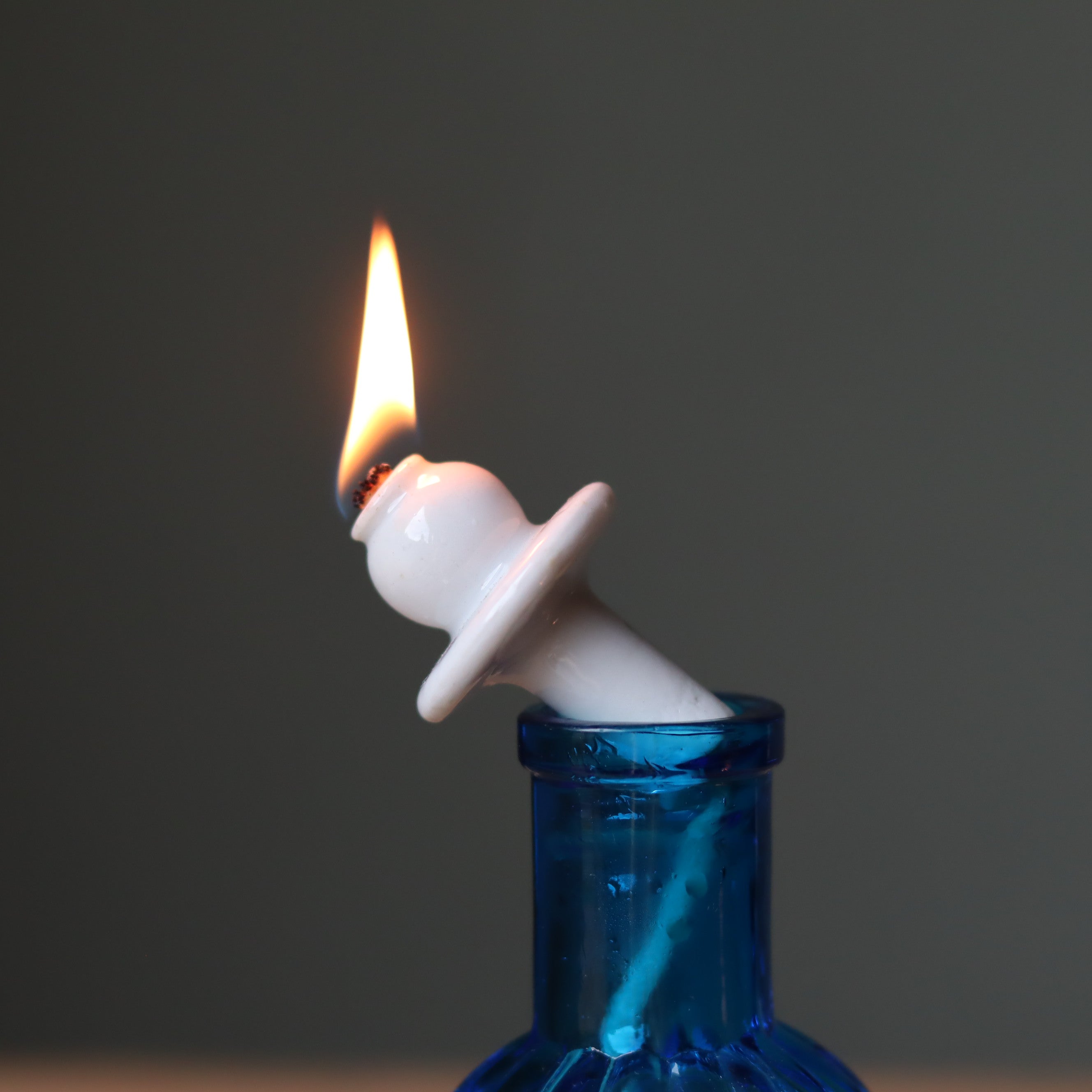Rare Vintage French Oil Lamp – Blue Glass Bedside Nightlight (1930s–1950s) with lit wick and blue glass reservoir