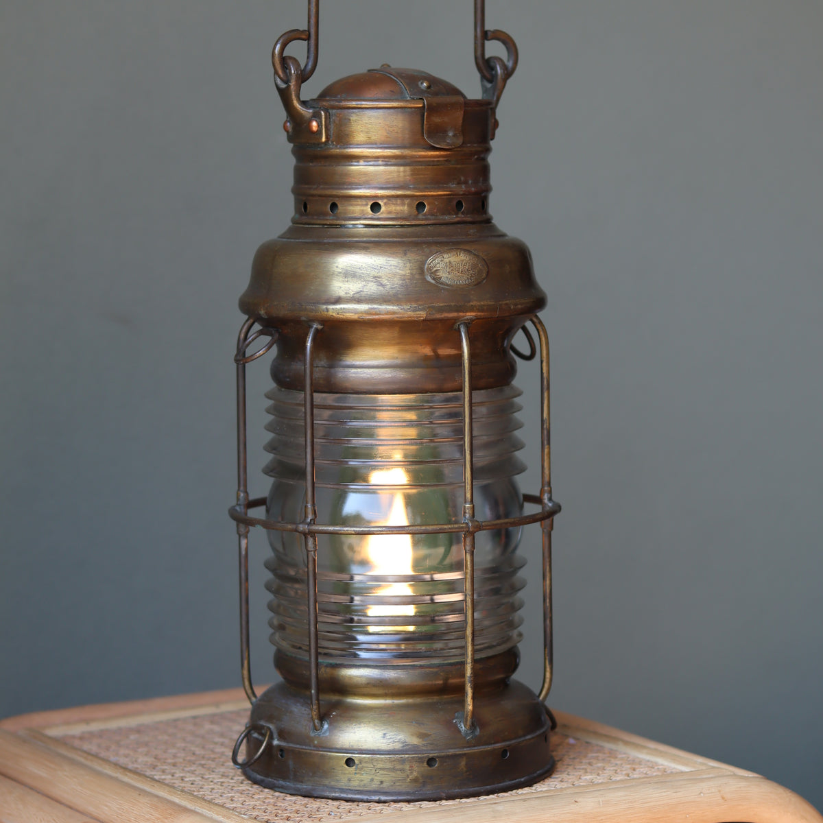 Vintage Perko Ship’s Lantern – Anchor Light (Copper, Brass & Bronze) showing lit oil lamp with protective cage