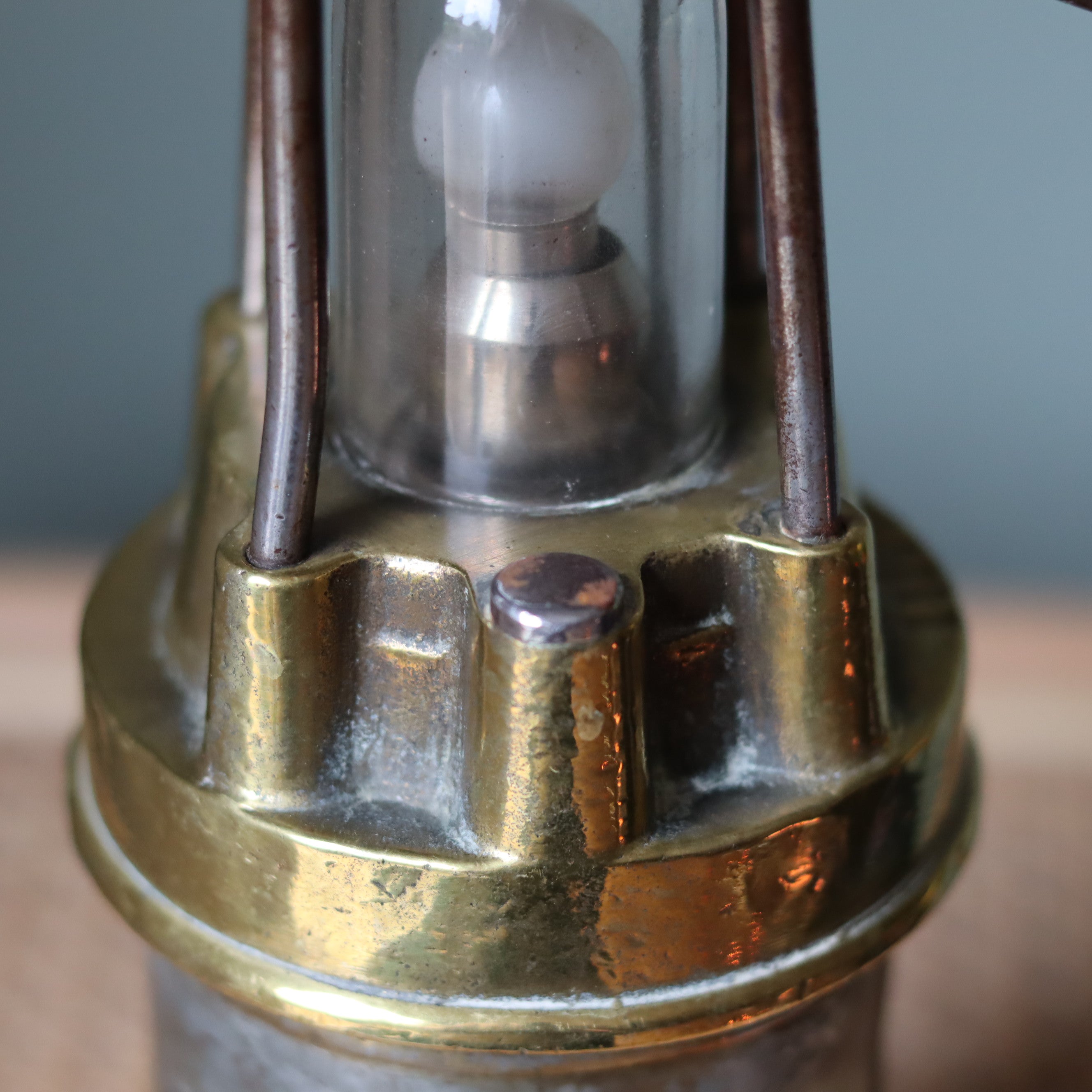 Close-up of the Vintage Mining Lamp – Pot Lamp – Numbered 1350 – Bronze & Steel – Circa 1950s–1960s showcasing its oil lamp design.