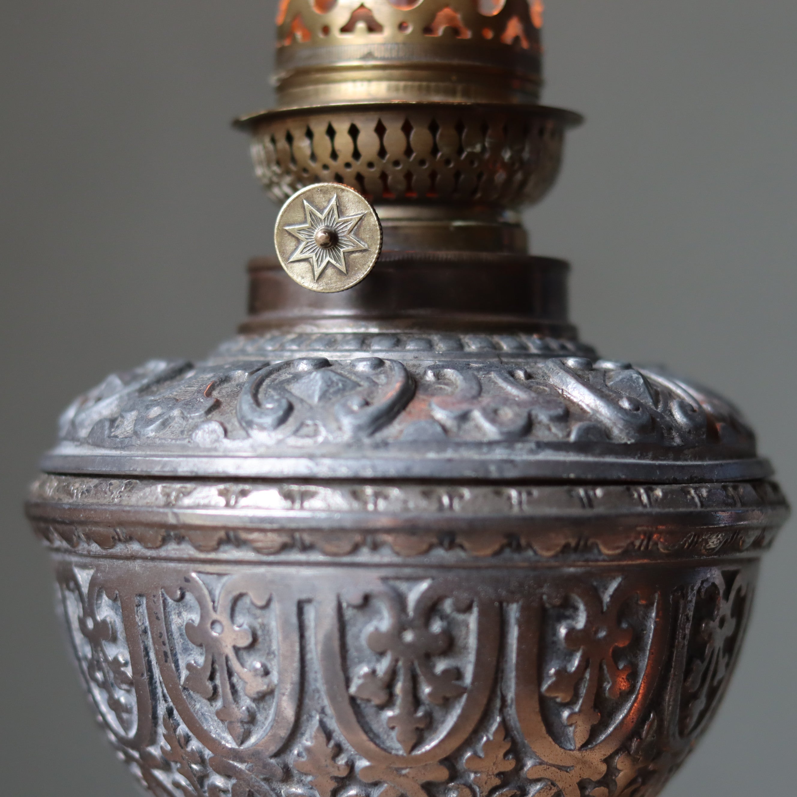 Vintage Decorative Oil Lamp – Metal Base & Glass Reservoir – Large Chimney – 1950s–1970s with detailed ornate metalwork design close-up