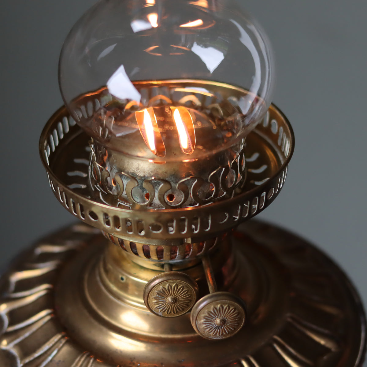 Vintage Brass Oil Lamp – Duplex Double Wick Burner – Yellow Glass Shade – 1950s–1970s showing lit wicks and detailed brass design