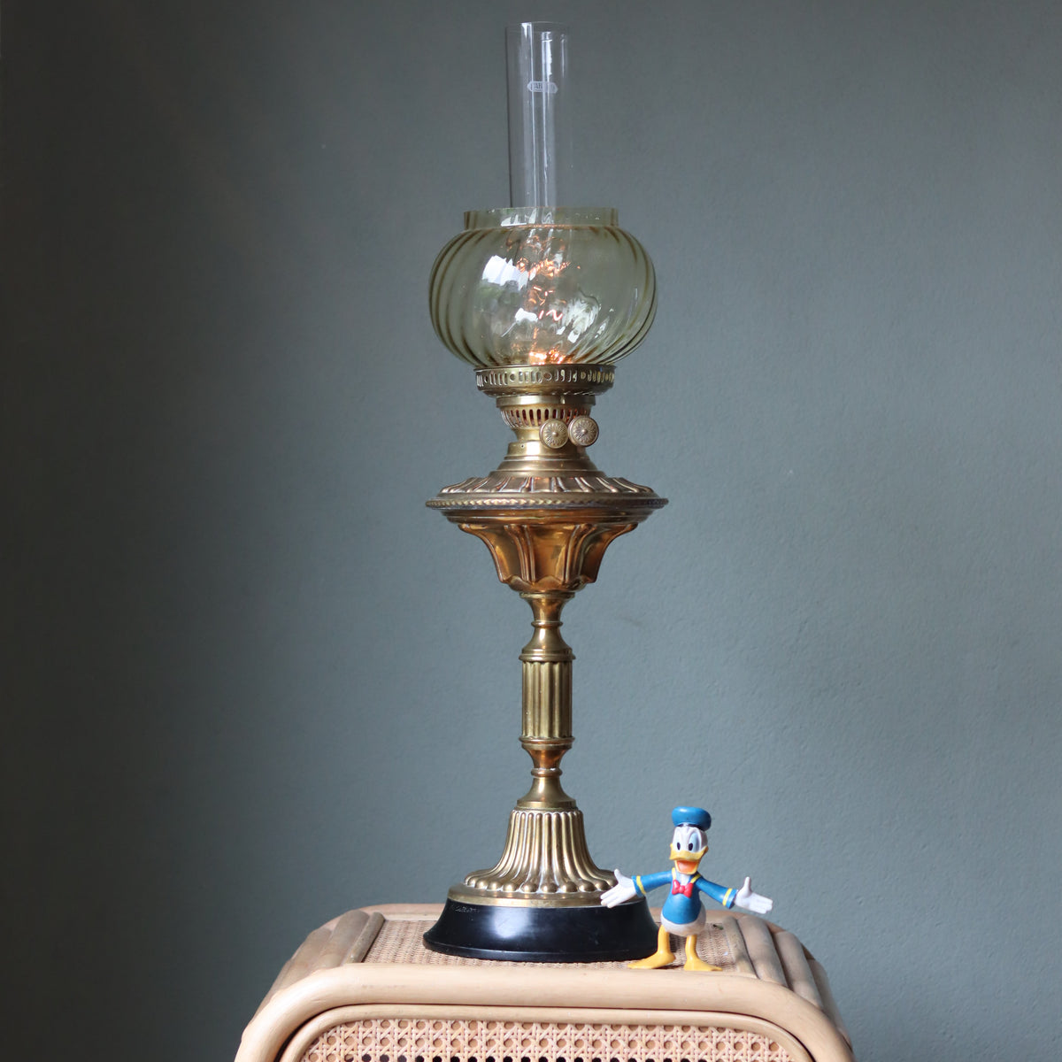 Vintage Brass Oil Lamp – Duplex Double Wick Burner – Yellow Glass Shade – 1950s–1970s on wooden surface with figurine