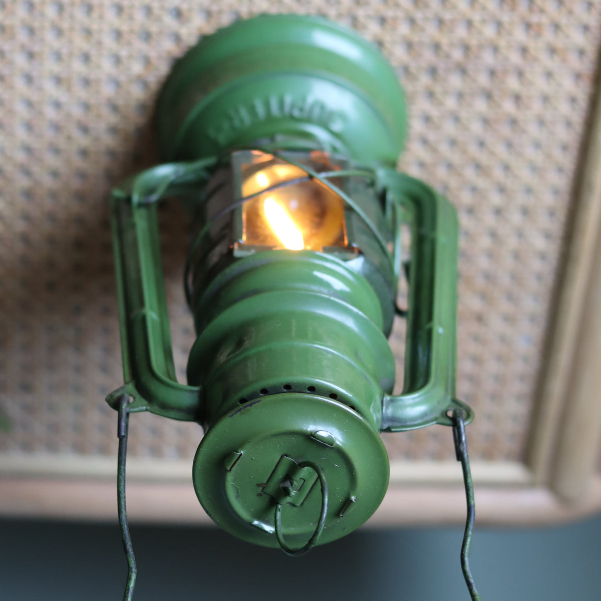 Rare Vintage Jupiter-1 Green Hurricane Lantern – Unique Flat Glass Holder with Red & Clear Panels oil lamp lit from front angle