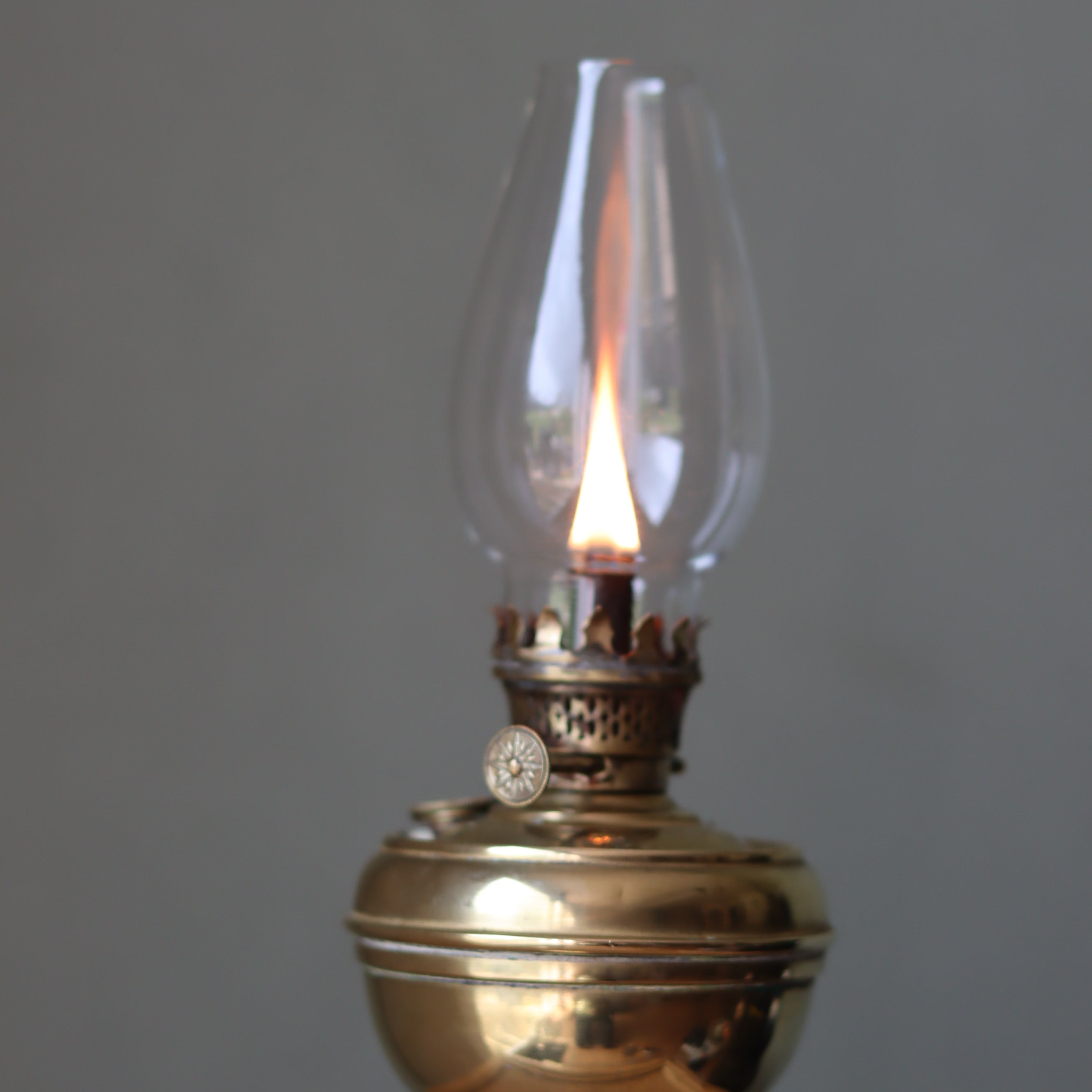Rare Antique Oil Lamp with Unique Hollow Wick – Elegant Brass Design (c.1900–1930) lit with glass chimney flame