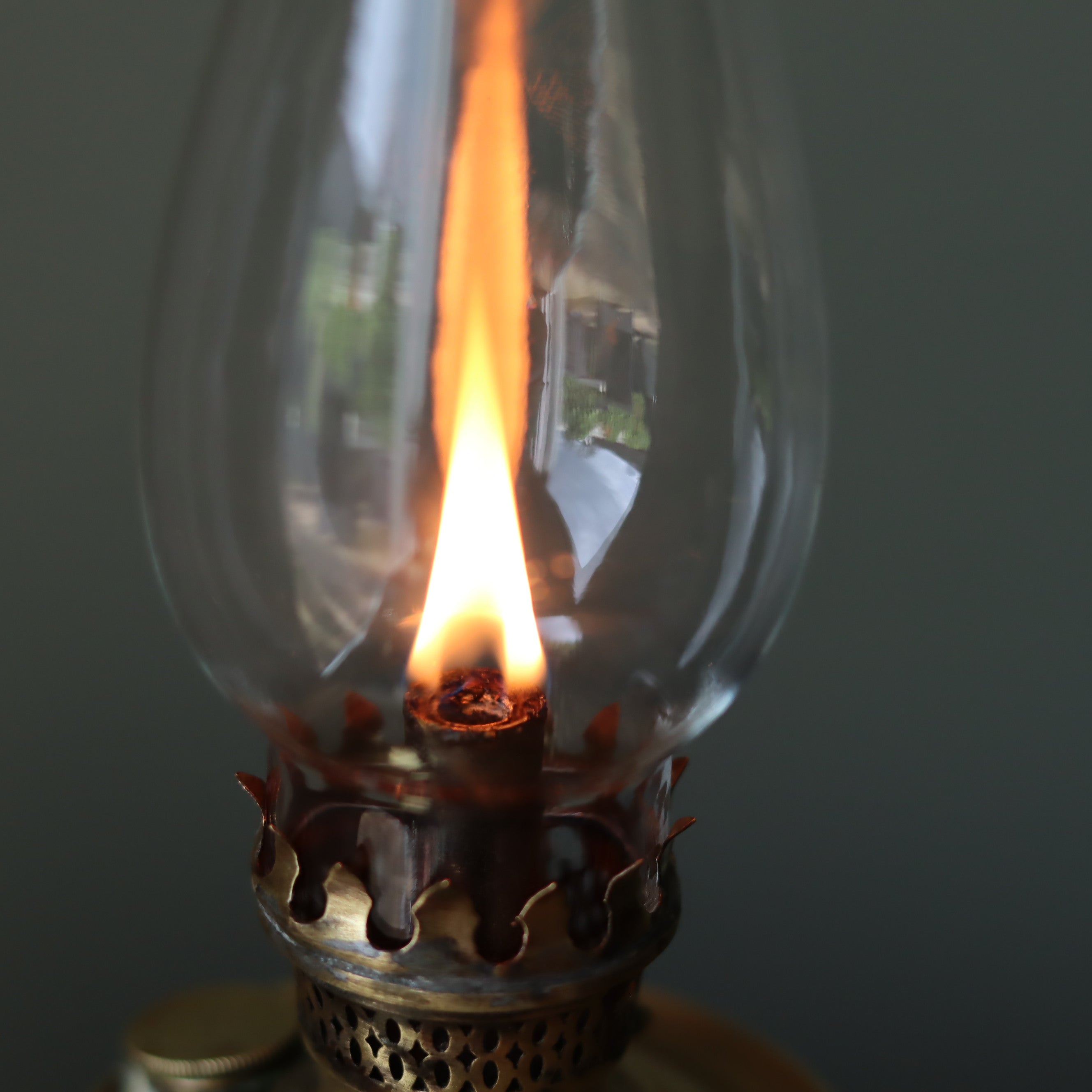Rare Antique Oil Lamp with Unique Hollow Wick – Elegant Brass Design (c.1900–1930) close-up of lit flame and glass chimney