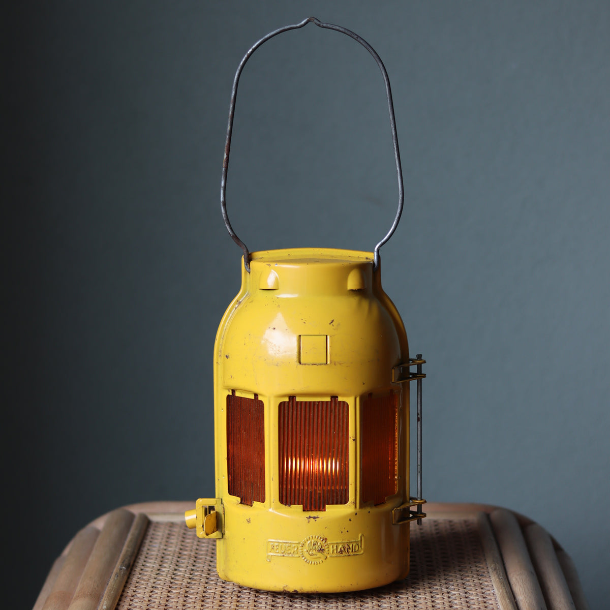 Vintage Feuerhand Yellow Roadwork Lantern – Tealight Safety Lamp (1960s/70s) shown glowing with original oil lamp design.