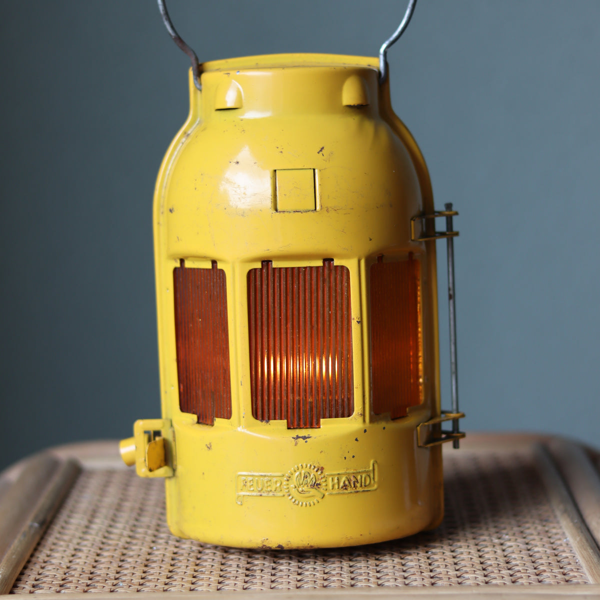 Vintage Feuerhand Yellow Roadwork Lantern – Tealight Safety Lamp (1960s/70s) showing classic yellow oil lamp design and brand detail.