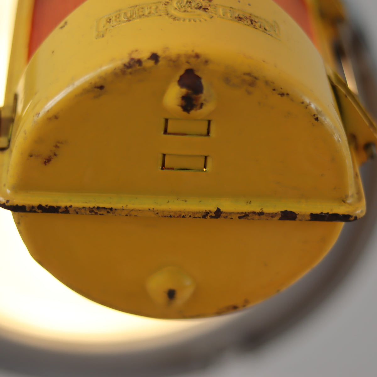 Vintage Feuerhand Yellow Roadwork Lantern – Tealight Safety Lamp (1960s/70s) showing detailed rust and wear on the oil lamp base