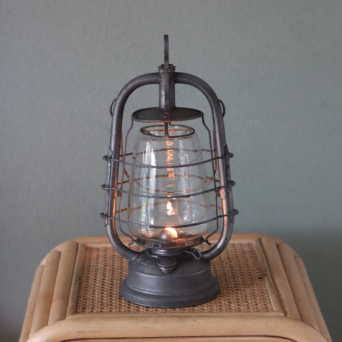 Rare Vintage Frowo Hurricane Lantern – Model No. 435 (1960s–1970s) classic oil lamp with metal frame and glass chimney lit on wooden surface