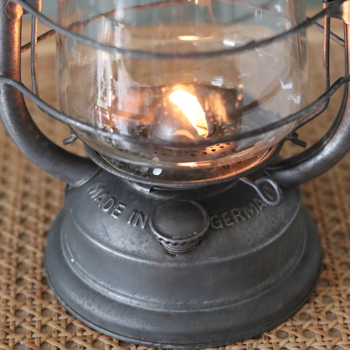 Rare Vintage Frowo Hurricane Lantern – Model No. 435 (1960s–1970s) showing its lit oil lamp and metal base details