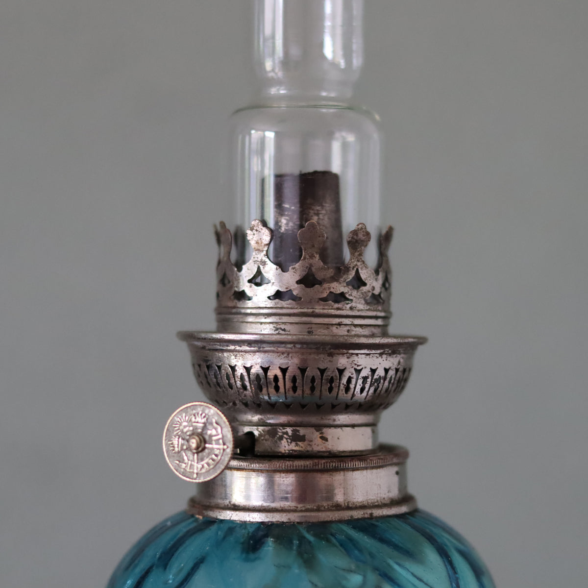 Rare Vintage French Oil Lamp – SI Paris Burner – close-up of chrome burner and blue glass reservoir from 1930s