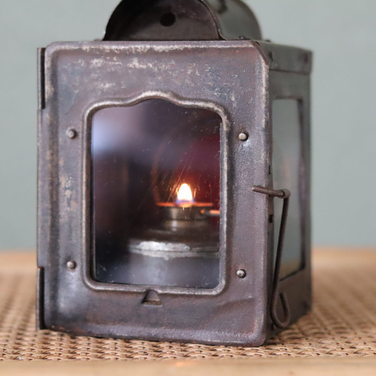 Rare Vintage Lantern – 1930s Automotive or Carriage Lamp oil lamp burning with visible flame inside aged metal frame