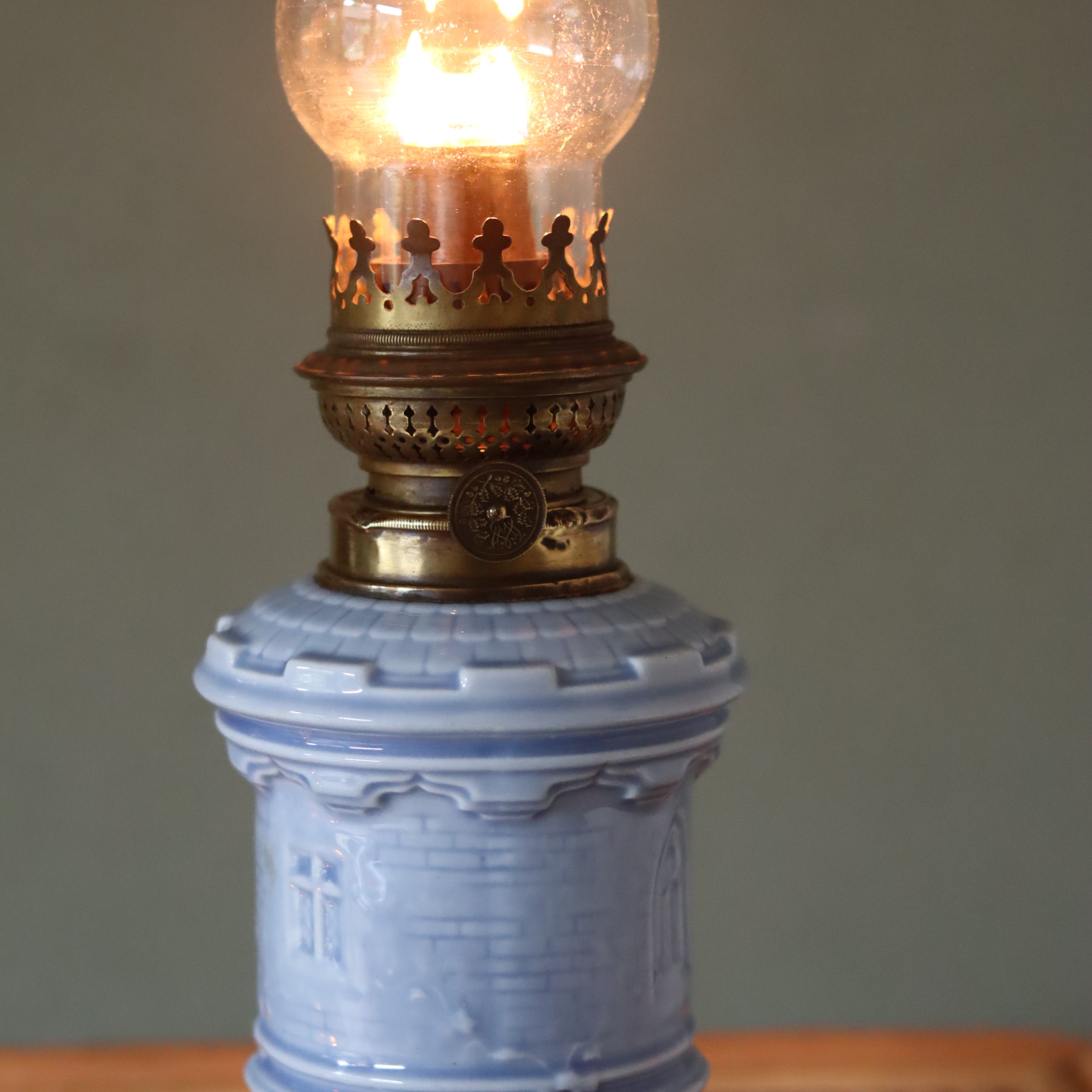 Rare Vintage Ceramic Oil Lamp – Tower Design with Wild & Wessel Burner 1930s in light blue ceramic base with lit flame