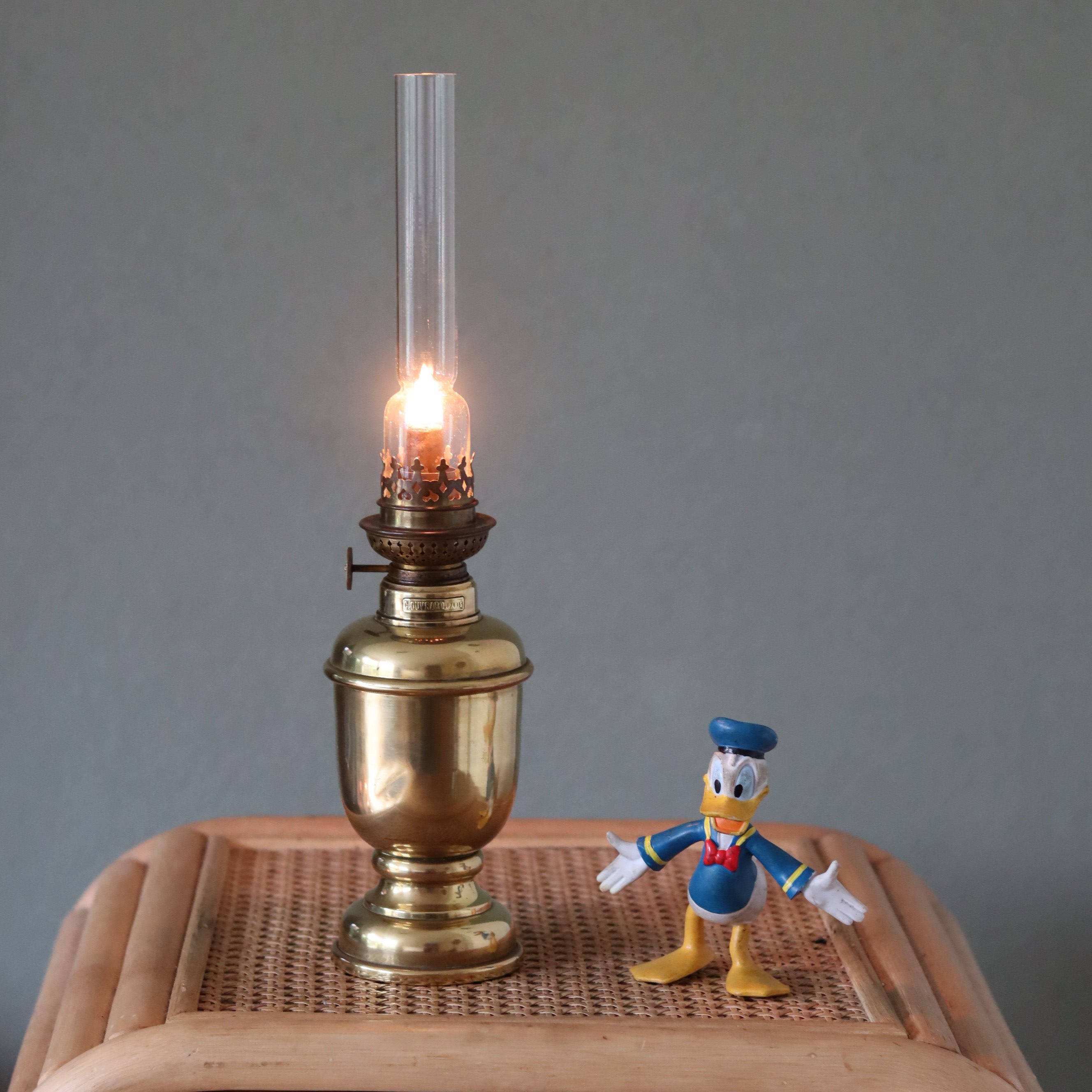 Rare Heavy Oil Lamp – C. Ouvrard Paris with Wild & Wessel Burner lit, showcasing antique brass craftsmanship circa 1930s–1950s