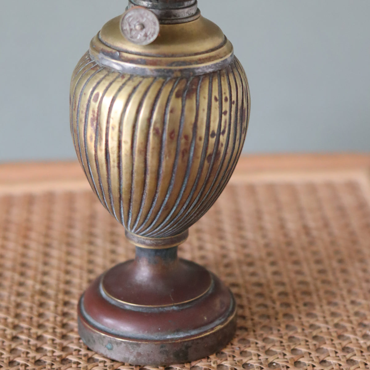 Vintage Oil Lamp with Wild & Wessel Burner – 1930s featuring a ribbed brass body and antique metal base design