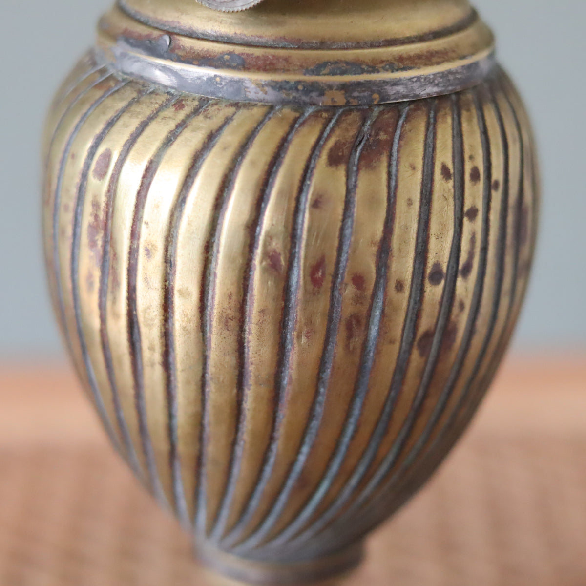 Close-up of Vintage Oil Lamp with Wild & Wessel Burner – 1930s showing detailed ribbed metal craftsmanship and aged patina