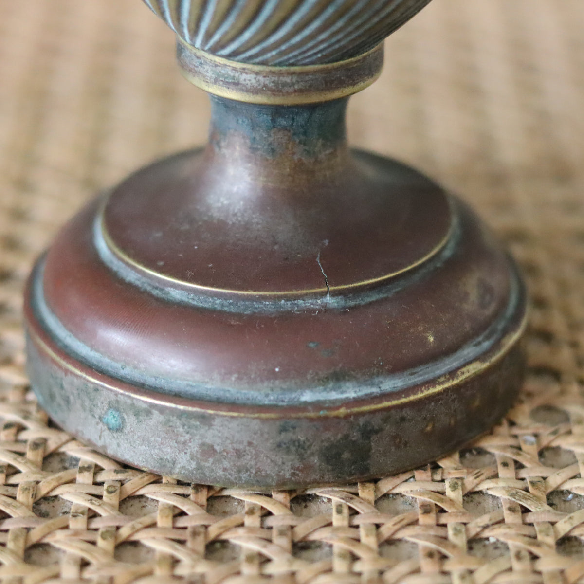 Close-up of the base of Vintage Oil Lamp with Wild & Wessel Burner – 1930s showing its antique metal craftsmanship
