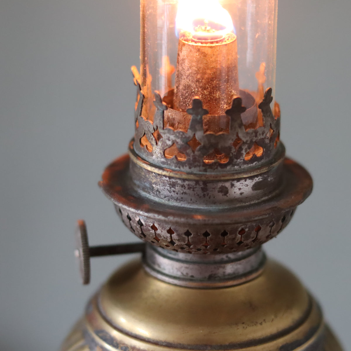 Vintage Oil Lamp with Wild & Wessel Burner – 1930s showing detailed metal burner and lit flame close-up