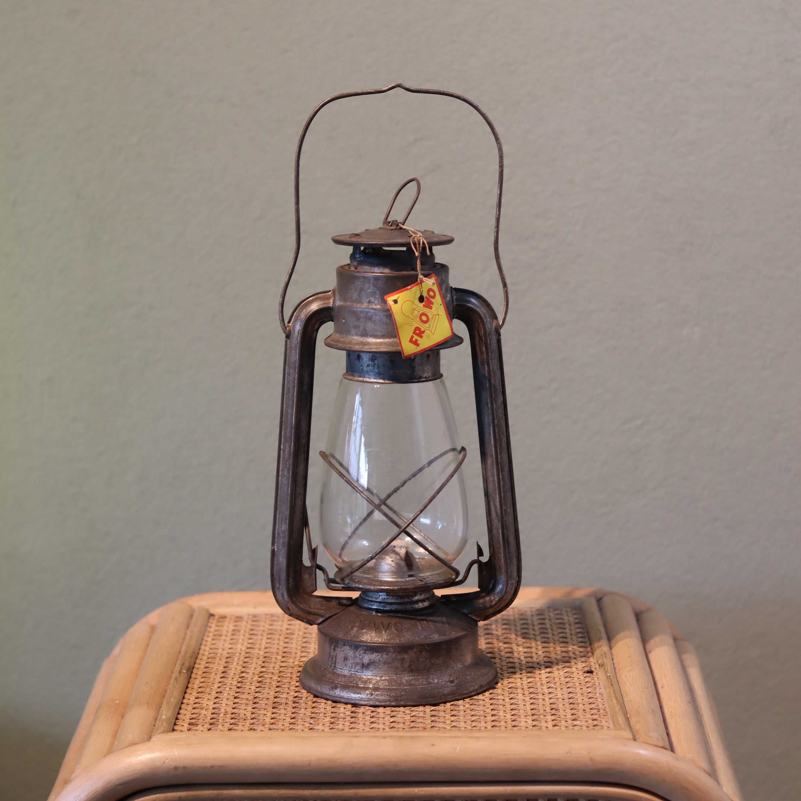 New Old Stock Vintage Frowo Hurricane Lantern – Model 75 (1960s/70s) oil lamp with original tag on woven surface