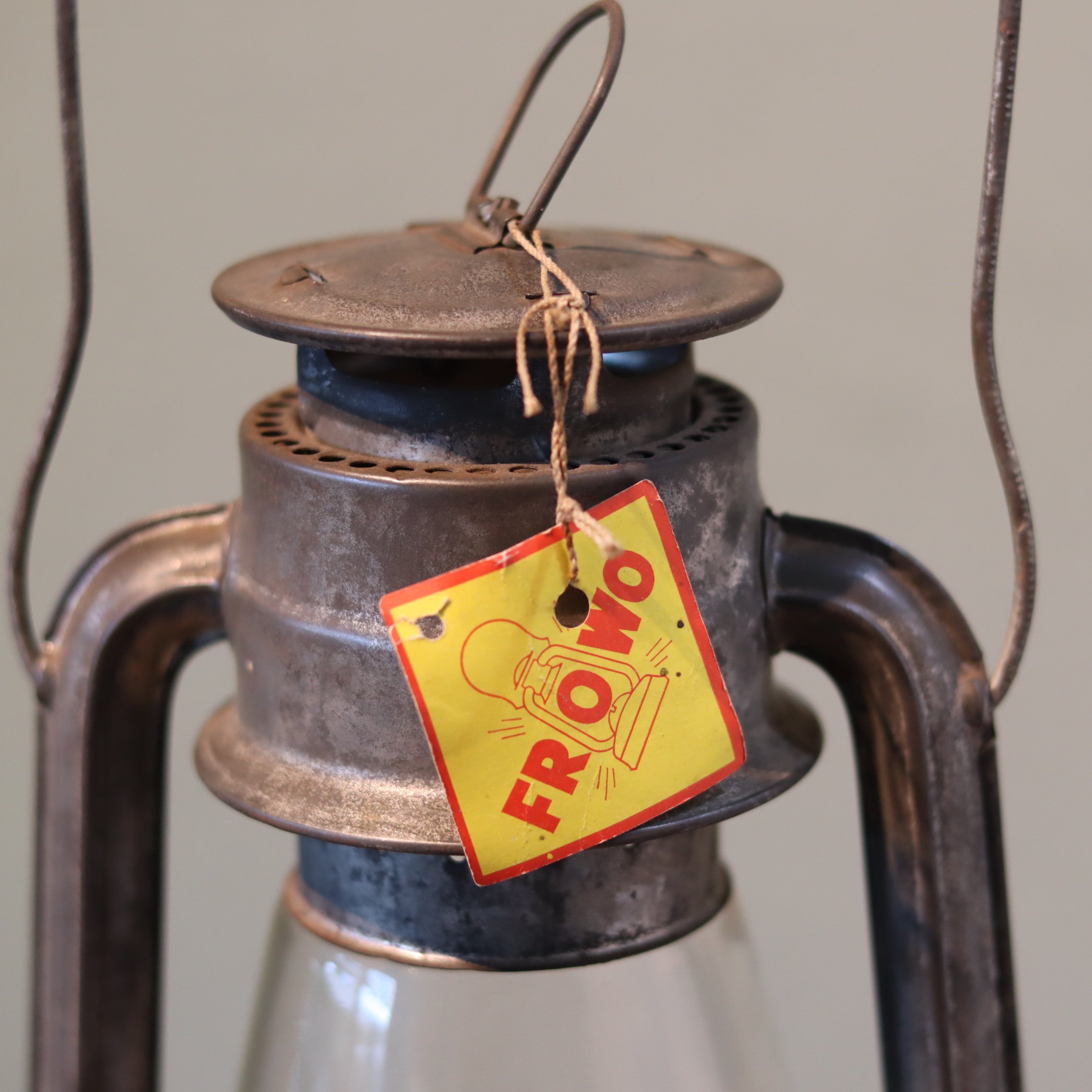Close-up of New Old Stock Vintage Frowo Hurricane Lantern – Model 75 (1960s/70s) oil lamp with original Frowo brand tag