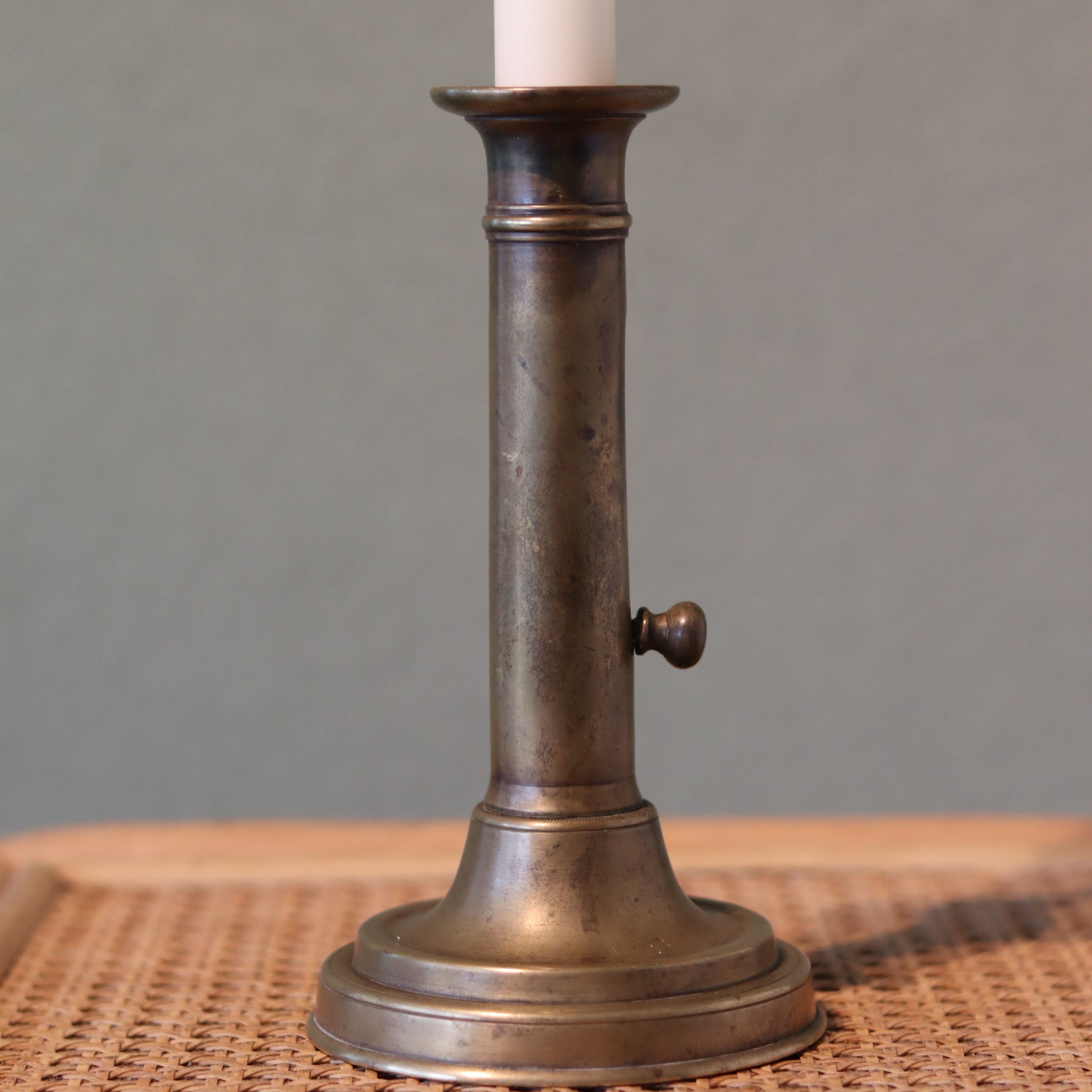 Vintage Bronze Candlestick with Adjustable Slide – Includes Candle – 1930s–1950s shown with classic oil lamp style design.