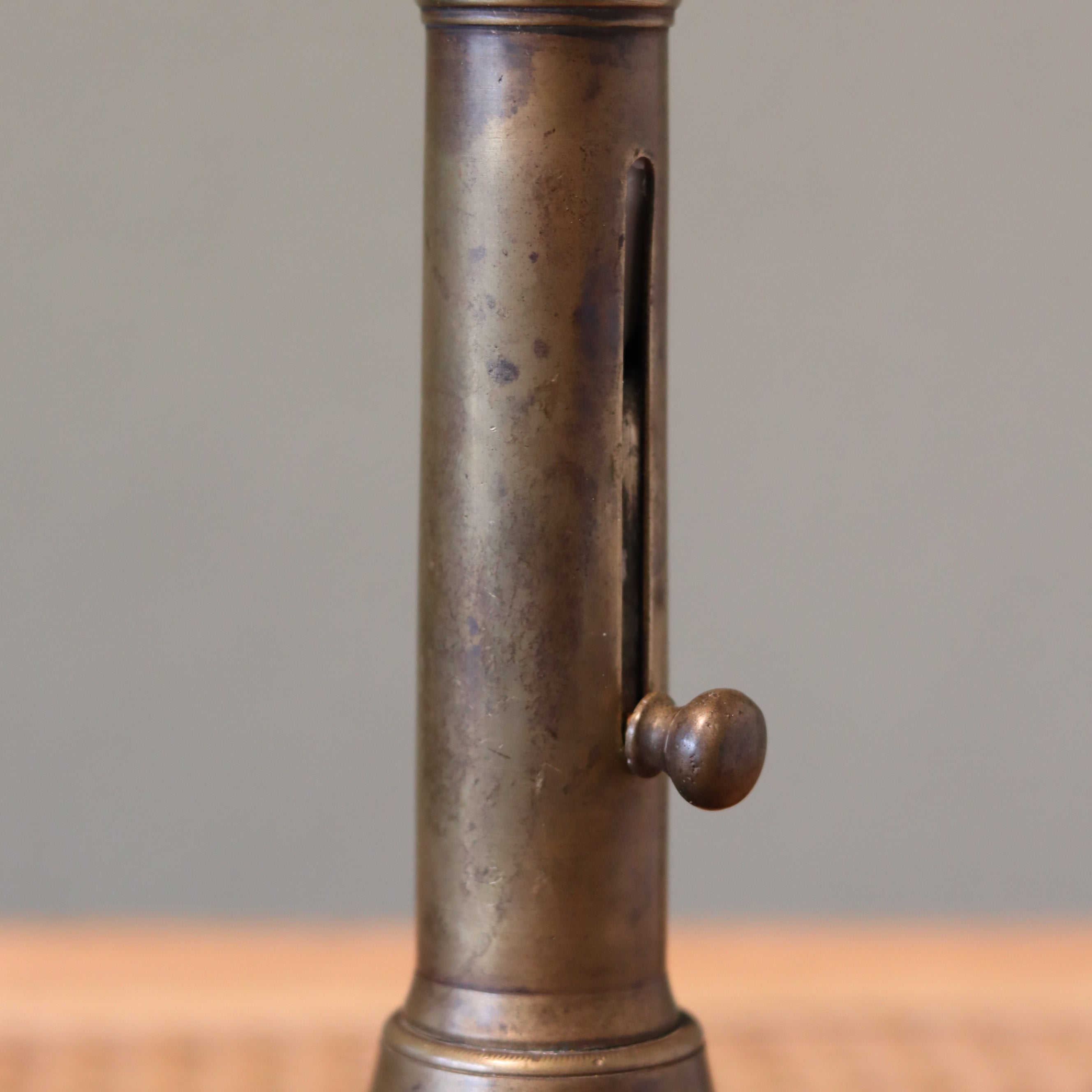 Close-up of the adjustable slide on the Vintage Bronze Candlestick with Adjustable Slide – Includes Candle – 1930s–1950s.