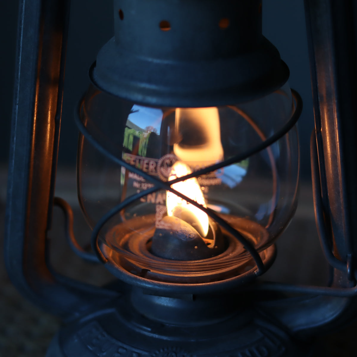 Restored Vintage Feuerhand Baby 275 Hurricane Lantern – Western Germany with lit oil lamp showcasing classic craftsmanship