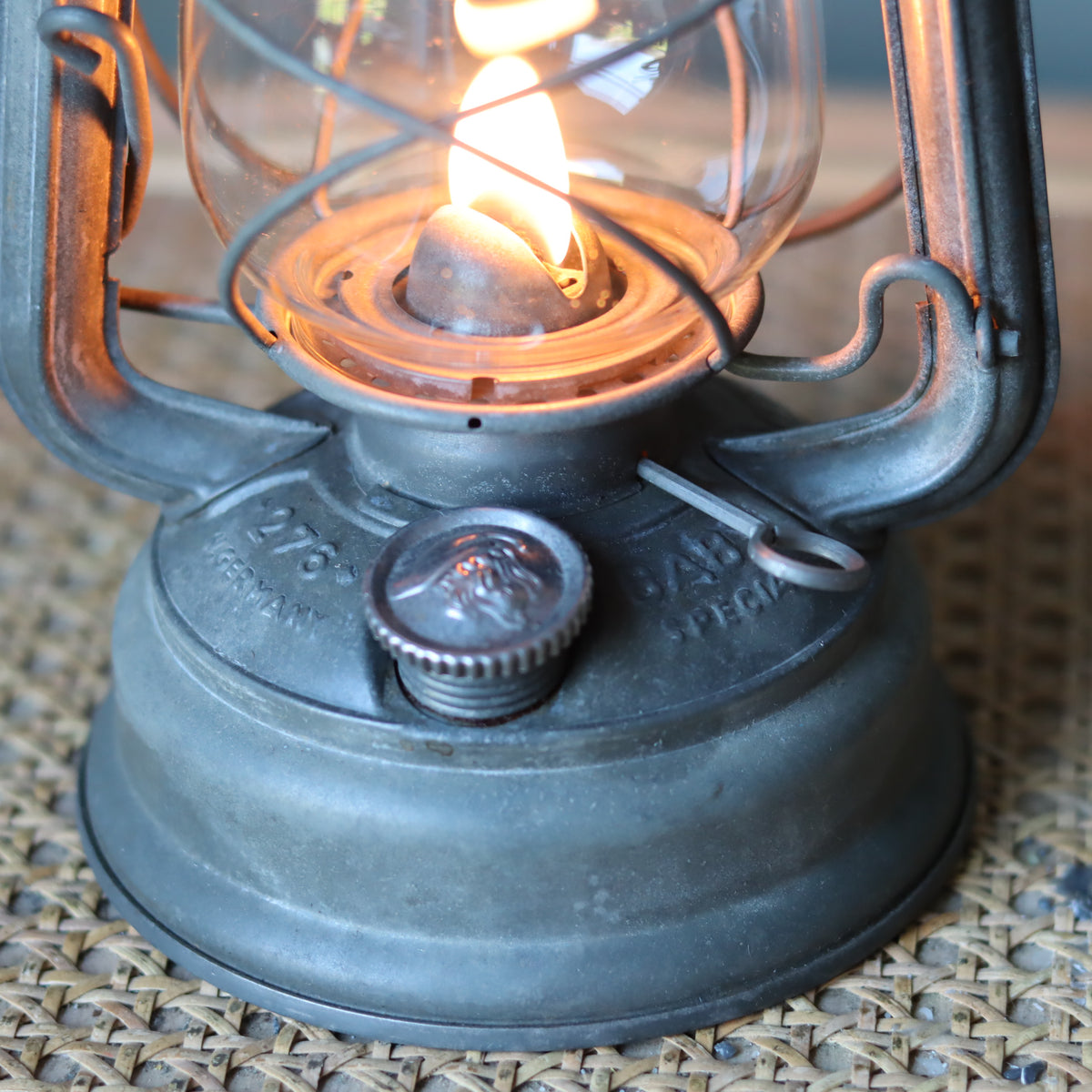 Restored Vintage Feuerhand Baby 275 Hurricane Lantern – Western Germany oil lamp with metal base and glowing flame detail