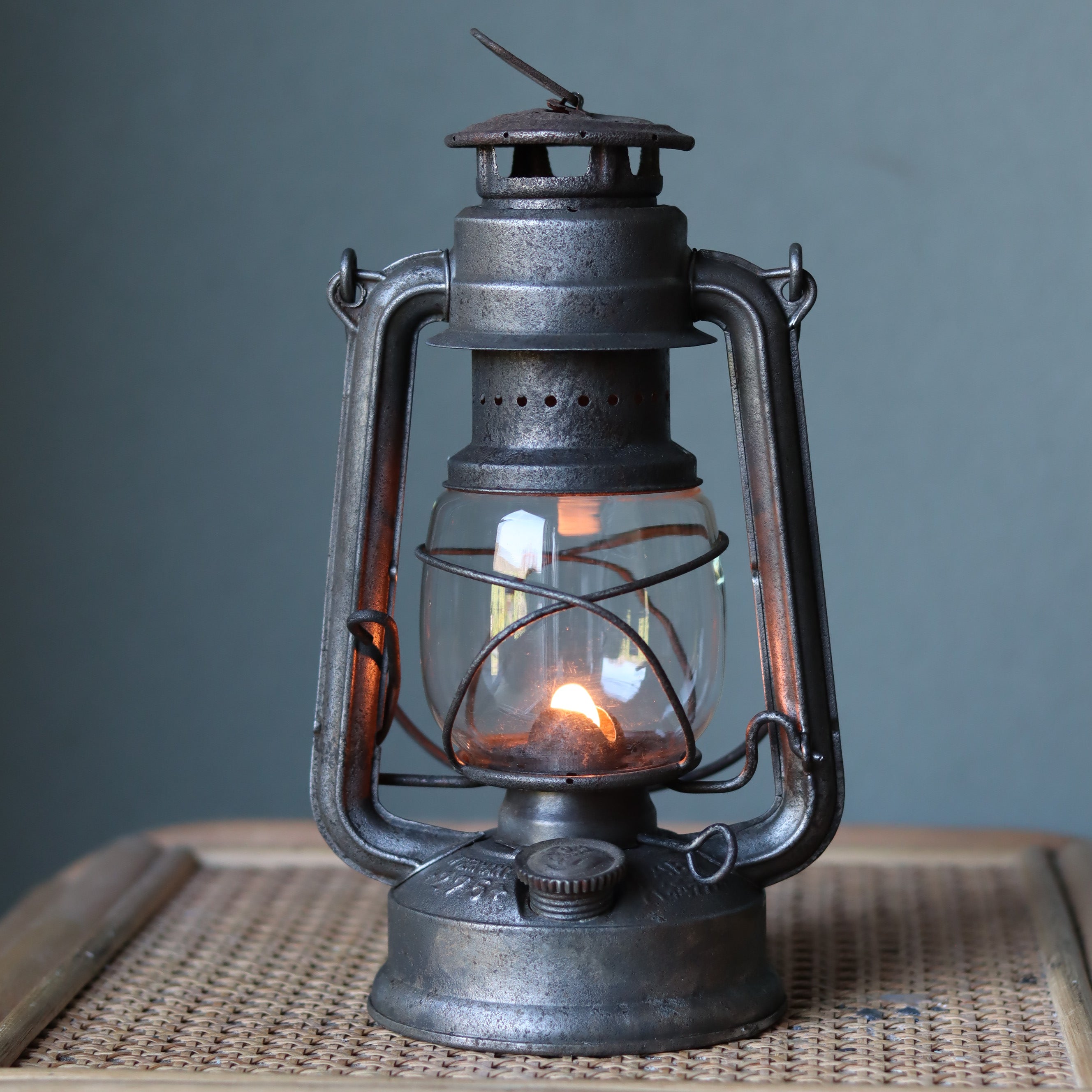 Vintage Feuerhand Baby 275 Hurricane Lantern – Western Germany, 1950s, Karlsruhe Marking oil lamp with glowing flame and metal frame
